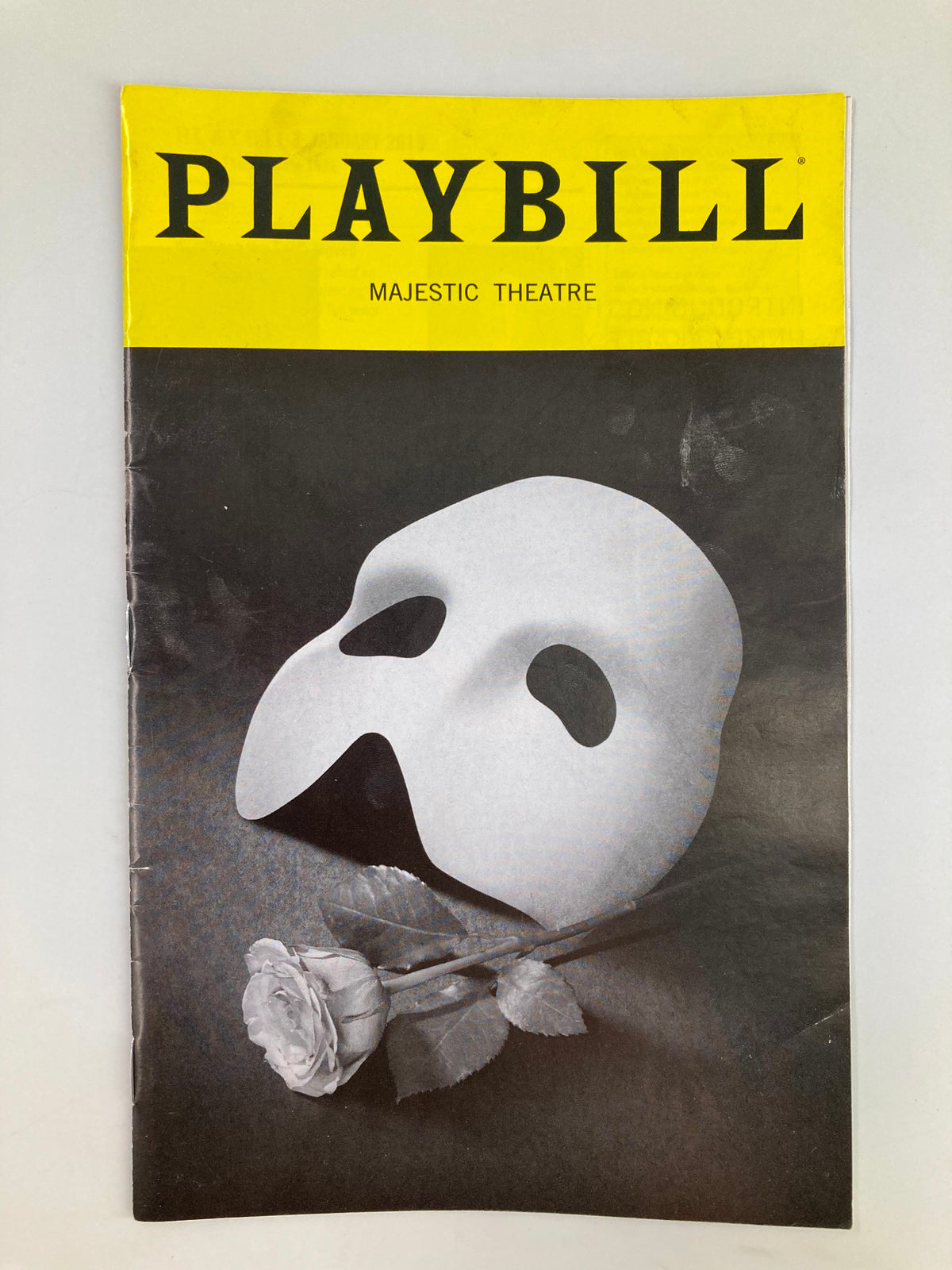 2019 Playbill for The Phantom of the Opera at Majestic Theatre featuring a classic Phantom mask and rose, showcasing iconic imagery from the show.