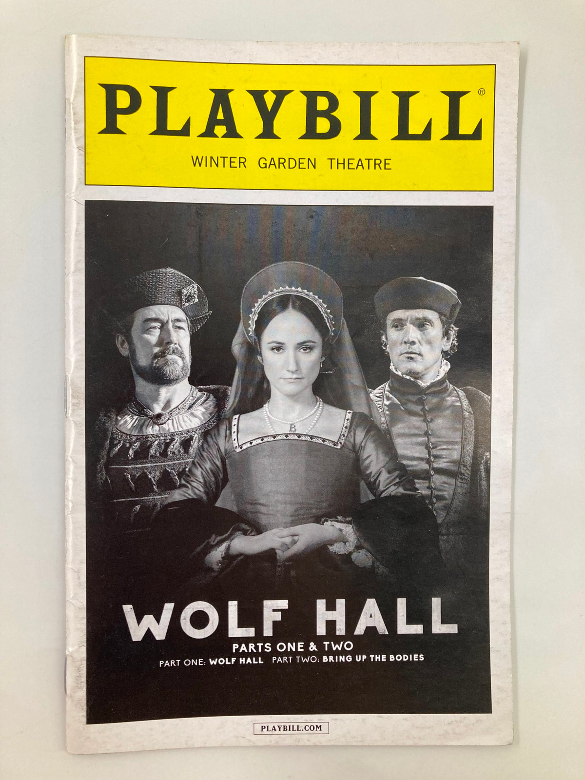 Front cover of the 2015 Playbill for Wolf Hall parts one and two at Winter Garden Theatre featuring characters from the play.
