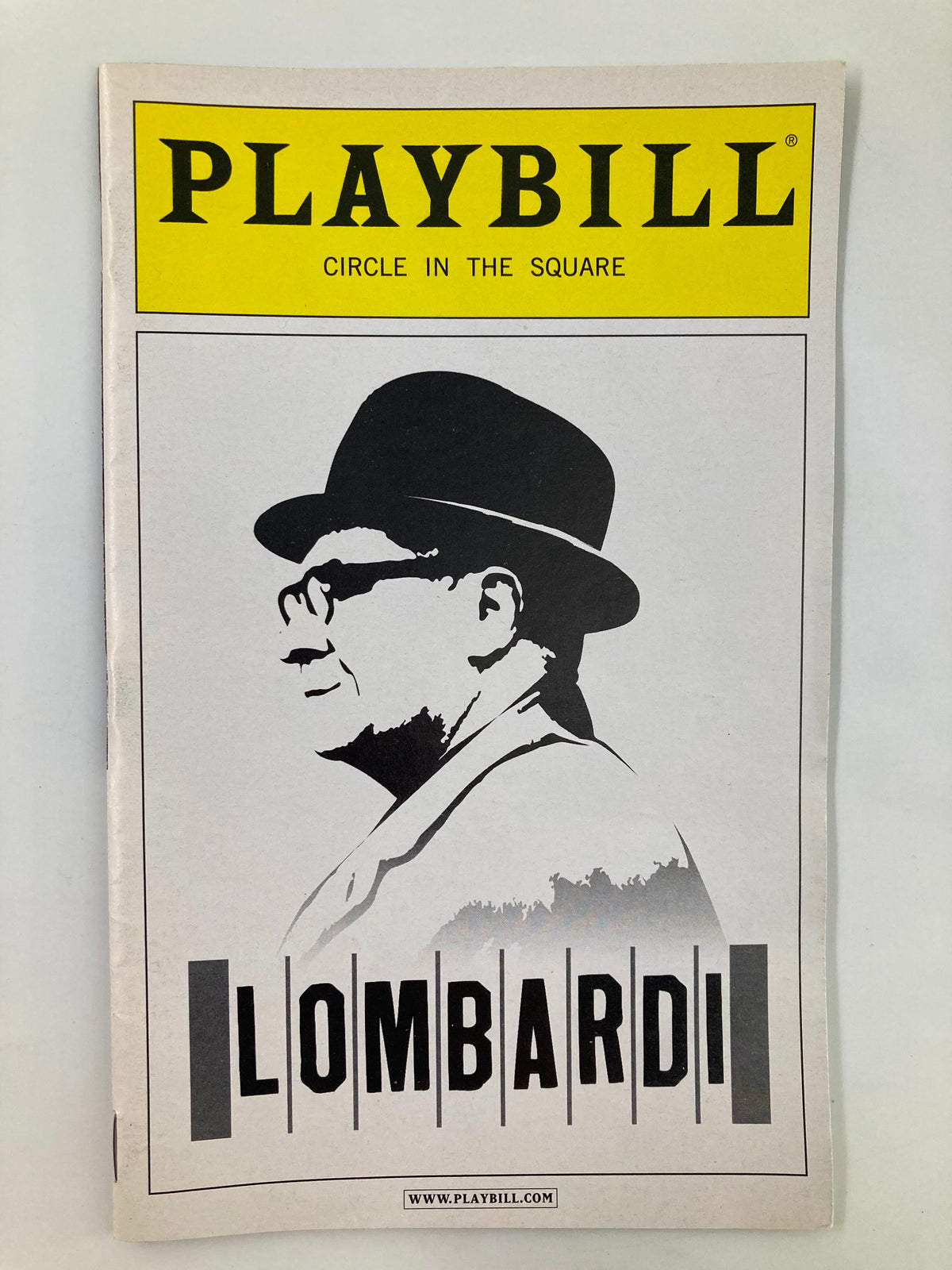 2010 Playbill for Lombardi featuring Circle in the Square, showcasing a profile illustration of the character in a hat.