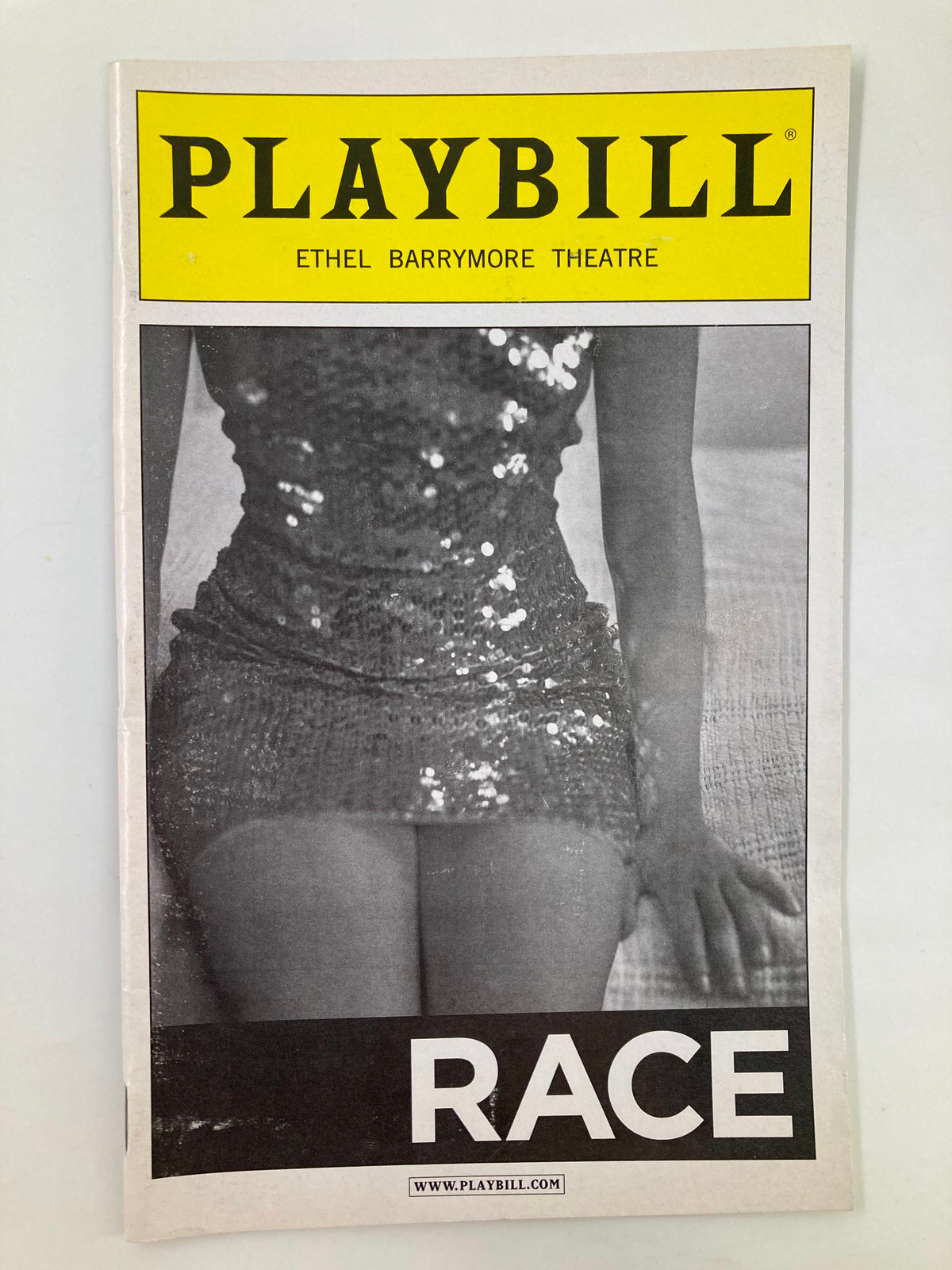 2010 Playbill for the Ethel Barrymore Theatre featuring the drama 'Race' with a striking cover showcasing a glamorous design.
