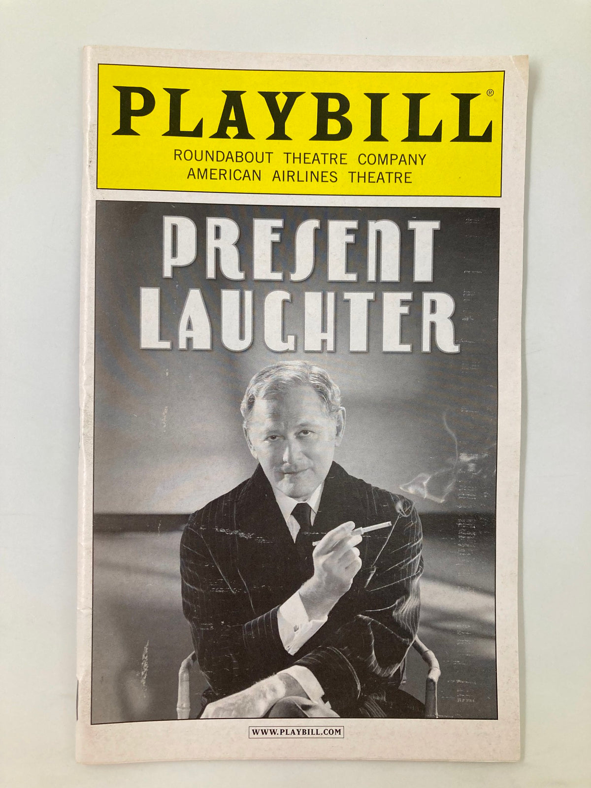Cover of the 2010 Playbill for Present Laughter featuring Victor Garber at the American Airlines Theatre. The design showcases the title 'Present Laughter' prominently.