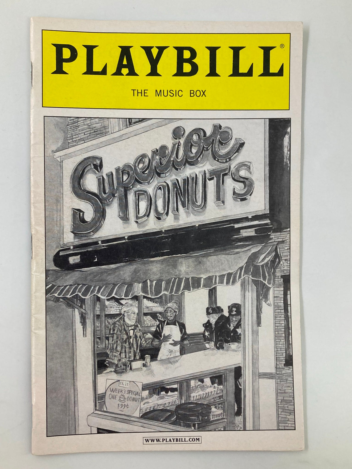 2009 Playbill for Superior Donuts at The Music Box, featuring a black and white illustration of the play's sign with characters displayed.