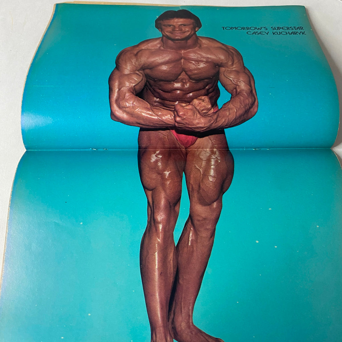 Centerfold of Muscle Up Magazine October 1983 Vol 5 No. 25 displaying Casey Kucharyk showcasing his physique, titled Tomorrow's Superstar.