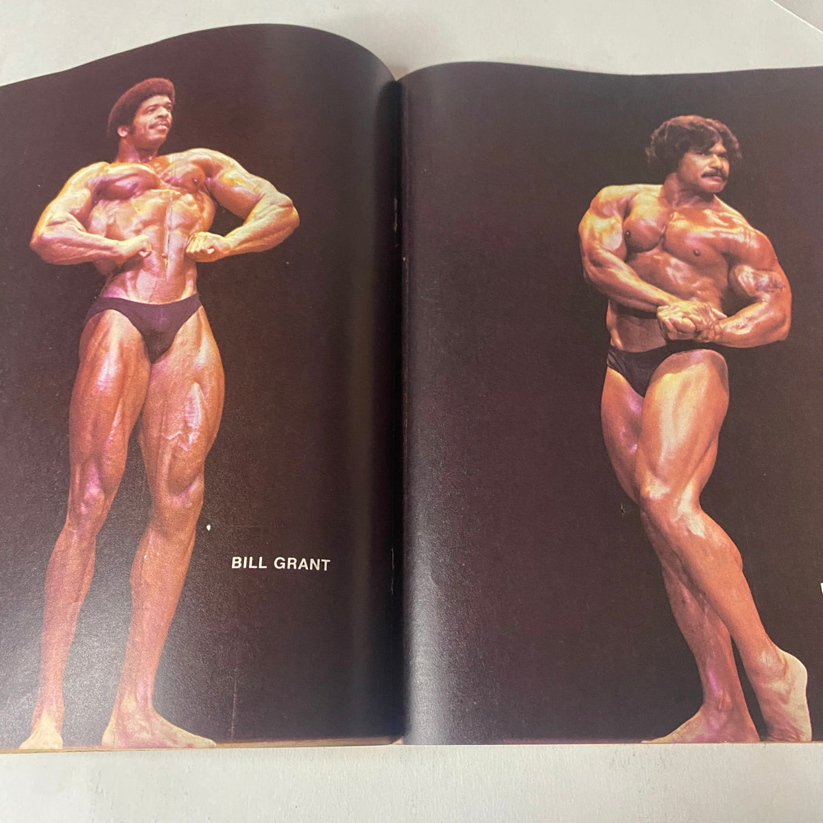 Full-color centerfold from Muscle Up Magazine December 1979, highlighting bodybuilder Bill Grant in classic bodybuilding poses.