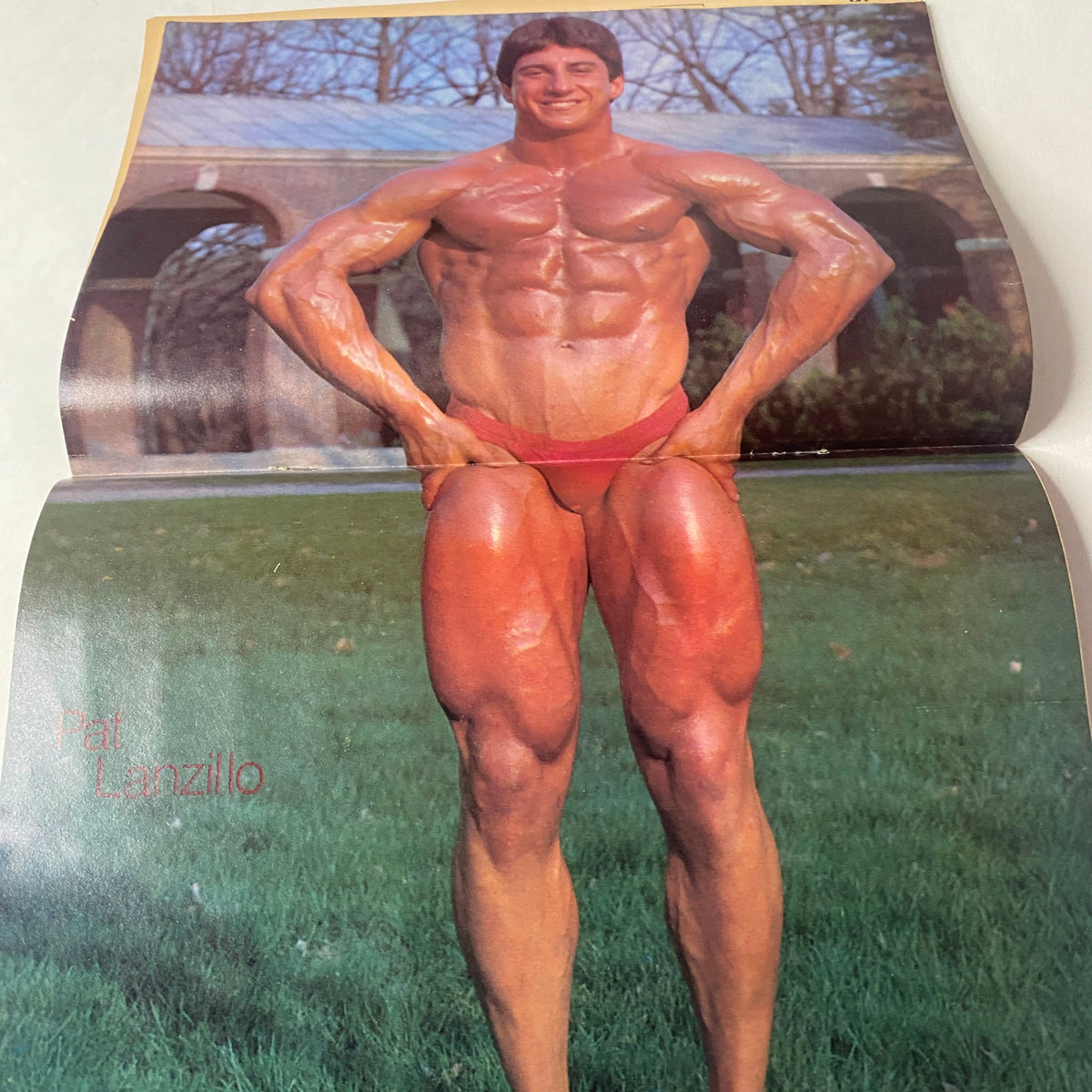 Centerfold of Muscle Up Magazine February 1984 Vol. 6 No. 27 featuring Pat Lanzillo posing in a bodybuilding stance, emphasizing muscle definition and athletic physique.