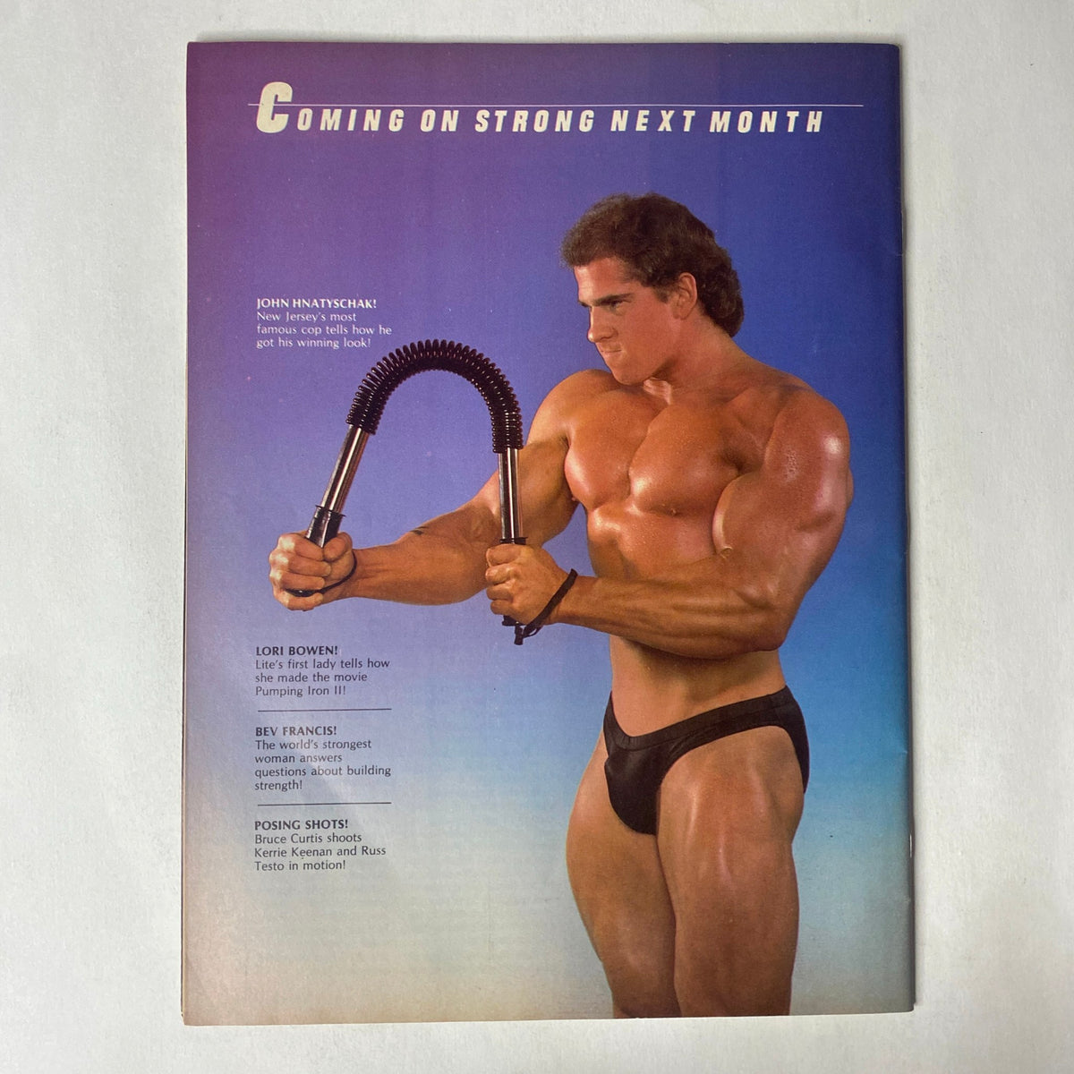 Back cover of Muscle Training Illustrated June 1985 featuring promotional content and images of upcoming bodybuilding features.
