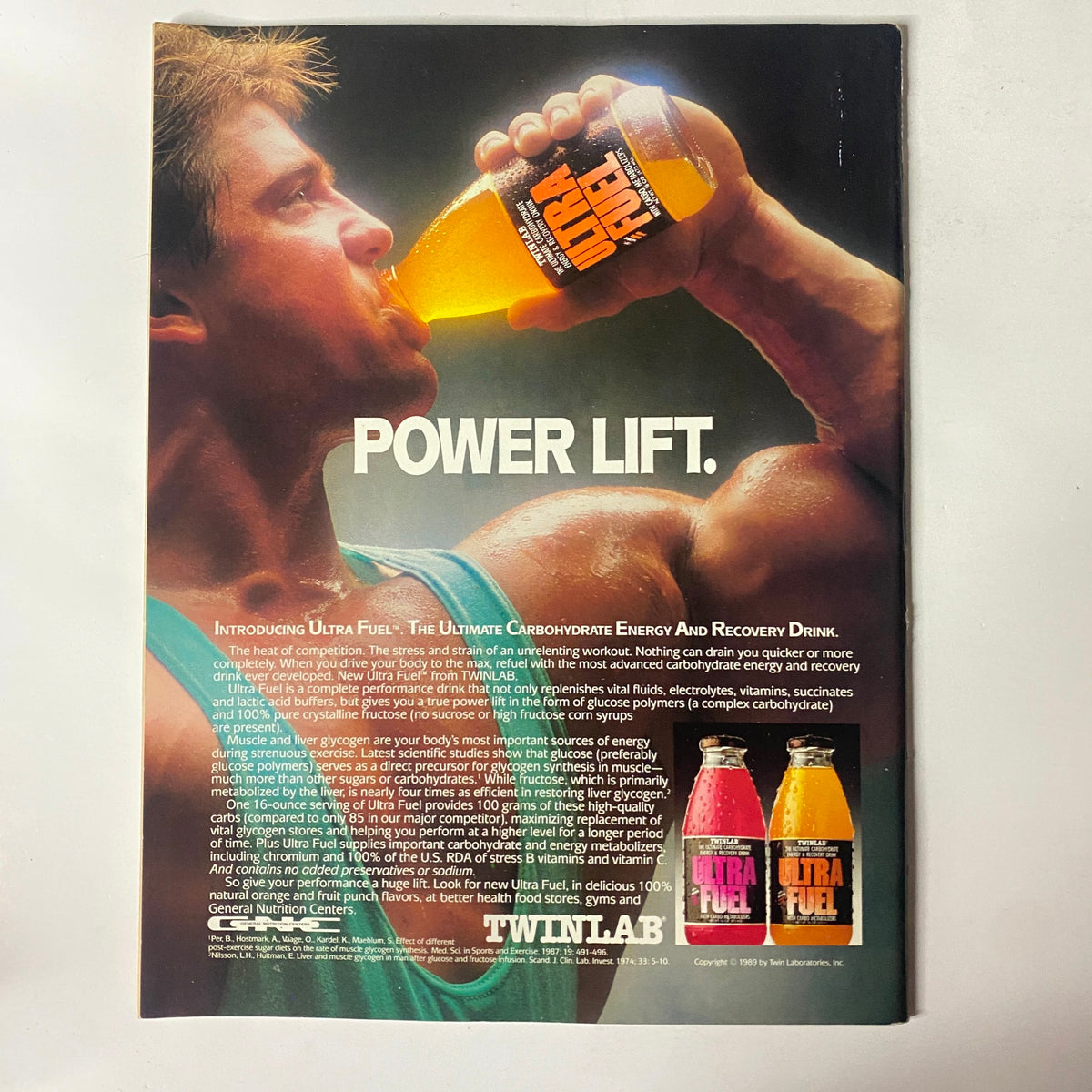 Back cover of Natural Body & Fitness Magazine July 1989 Vol 2 No 1 featuring a promotional advertisement for Twinlab Ultra Fuel energy drink, emphasizing 'Power Lift' with an athletic model showcasing fitness and energy recovery.