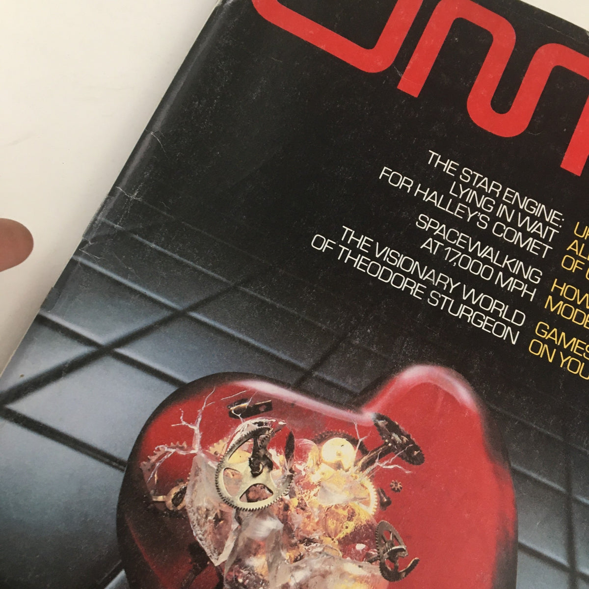 Close-up view of the cover of Omni Magazine February 1980, emphasizing the title 'The Star Engine For Halley's Comet,' with details of the cover art featuring a mechanical heart and highlighted articles.