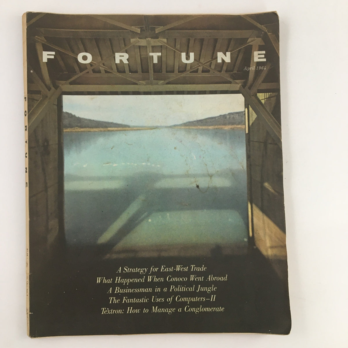 Cover of Fortune Magazine April 1964 featuring an idyllic landscape, showcasing the title and articles including 'What Happened When Conoco Went Abroad' and more.