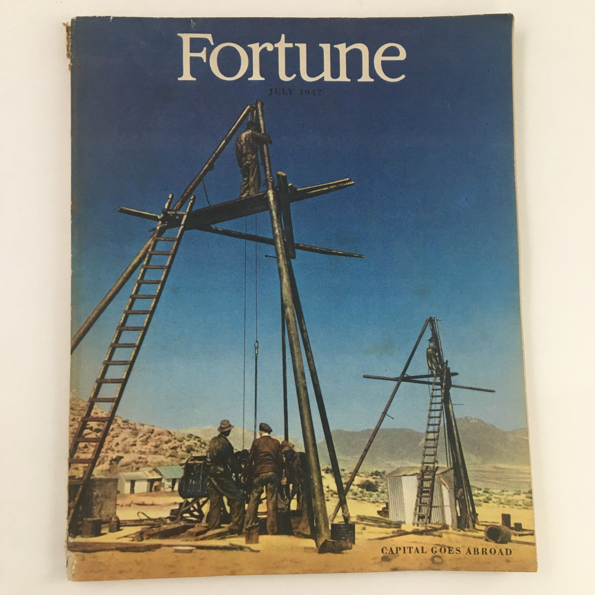 Cover of Fortune Magazine July 1947 Volume 36 Number 1 showcasing construction workers on a site against a blue sky.