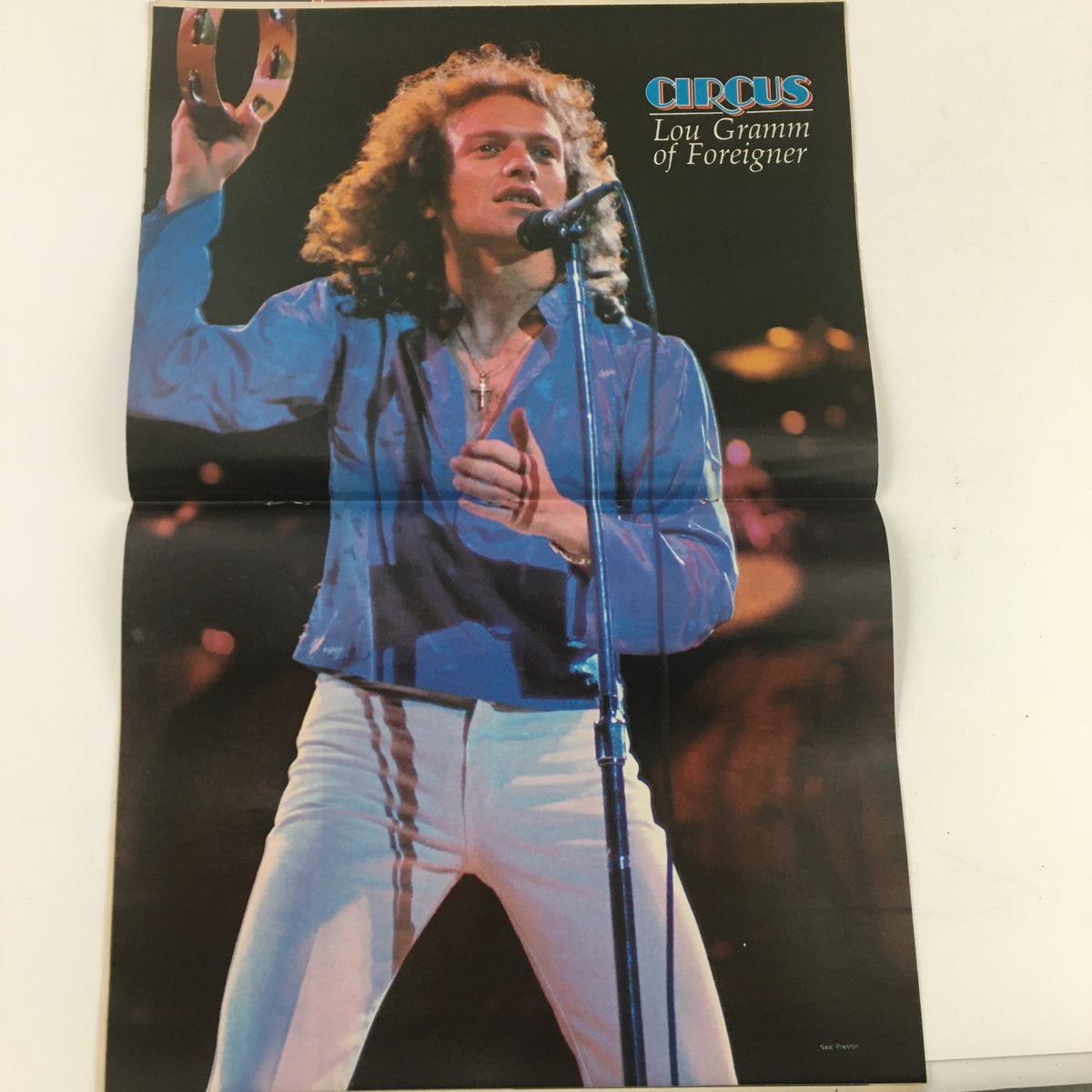 Lou Gramm of Foreigner performing live, featured in Circus Weekly Magazine October 24, 1978. Capturing the vibrant energy of 1970s rock music.