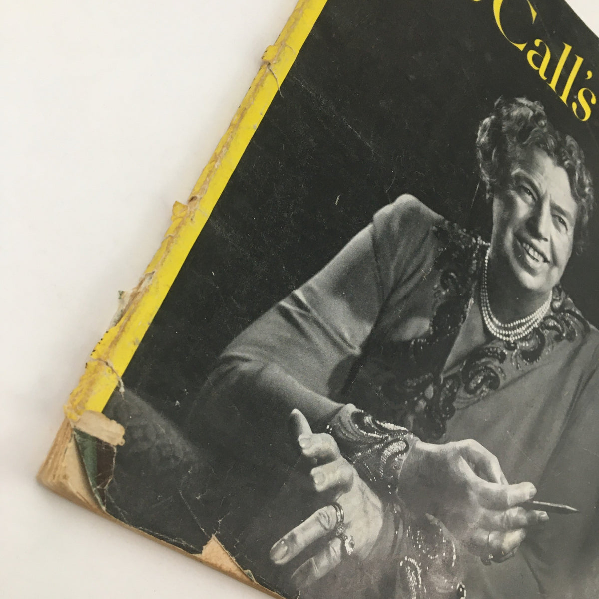 Detailed view of the edge of McCall's Magazine June 1949 with Anna Eleanor Roosevelt, showing wear and tear typical of vintage magazines, enhancing its collectible charm.