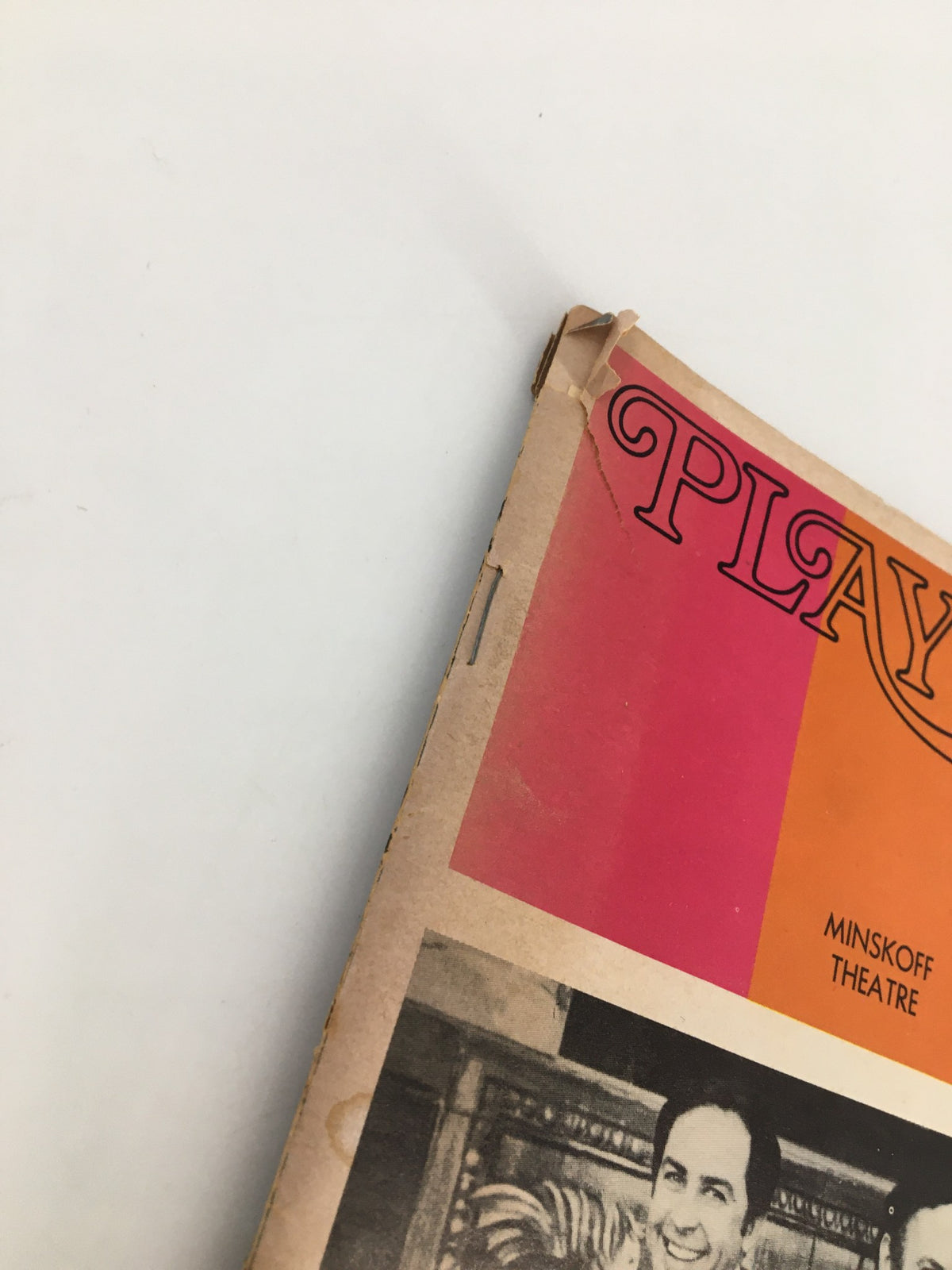 Close-up view of the edge of the 1973 Playbill for 'Irene: A Musical Comedy' highlighting details of the magazine's condition and design at the Minskoff Theatre.
