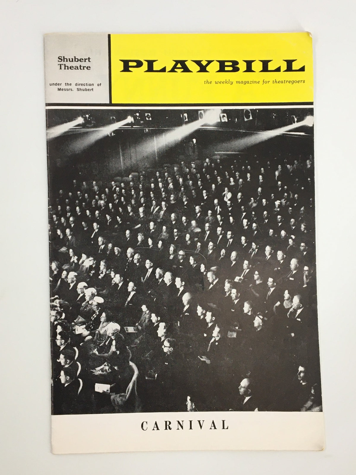 1963 Playbill from the Shubert Theatre featuring the enchanting musical 'Carnival' with a packed audience in the background.