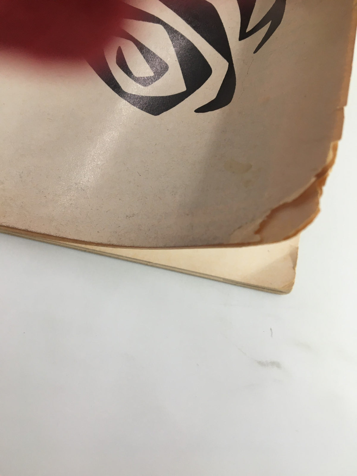 Side view of the 1966 Playbill from Billy Rose Theatre for The Rose Tattoo, highlighting the worn edges that illustrate its vintage character.