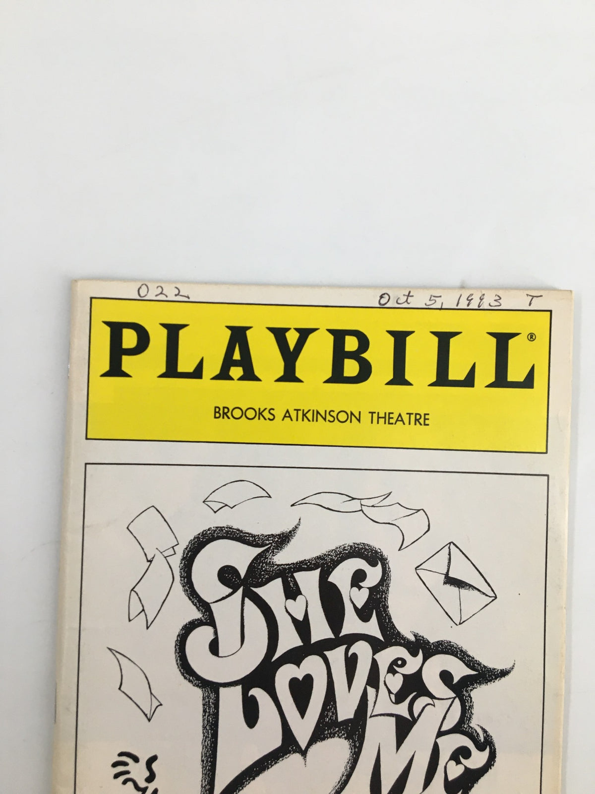 Close-up of the 1993 Playbill for 'She Loves Me' at Brooks Atkinson Theatre highlighting the iconic title and theatre branding.