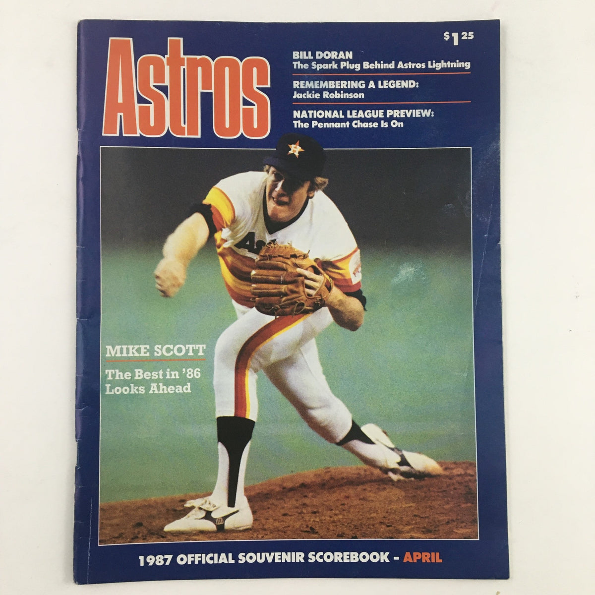 Official Souvenir Scorebook April 1987 featuring Astros players Mike Scott and Bill Doran, showcasing baseball memorabilia from a pivotal season.