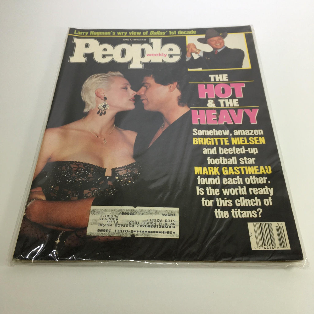 People Magazine cover from April 4, 1988 featuring Brigitte Nielsen and Mark Gastineau in a romantic pose, highlighting their captivating love story.