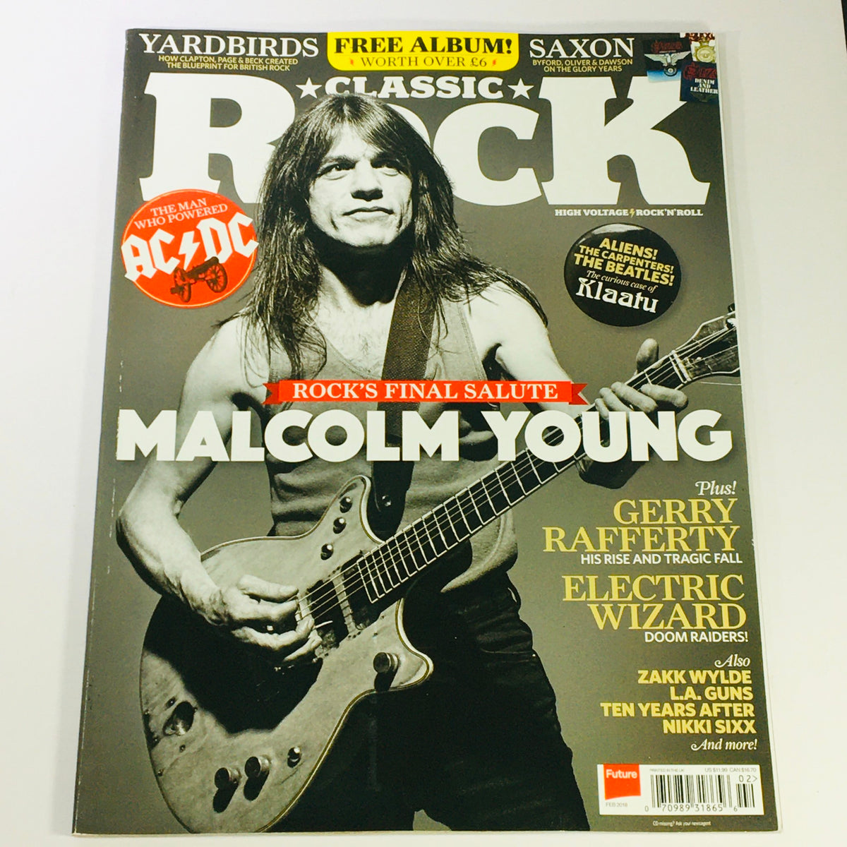 Classic Rock Magazine February 2018 issue #245 featuring Malcolm Young on the cover, showcasing a tribute to rock legends with headlines about AC/DC, Gerry Rafferty, and Electric Wizard. This UK import magazine is a must-have collectible for classic rock enthusiasts.