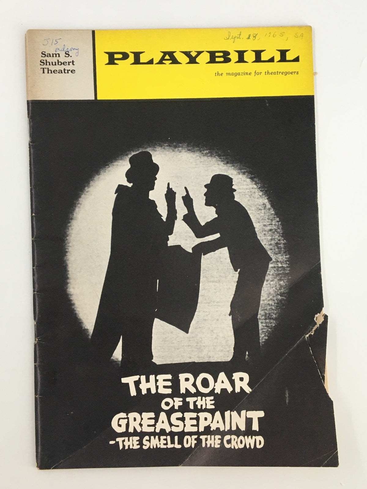 1965 Playbill for 'The Roar of The Greasepaint - The Smell of the Crowd' featuring artwork from the Sam S. Shubert Theatre, highlighting vibrant theatrical themes.
