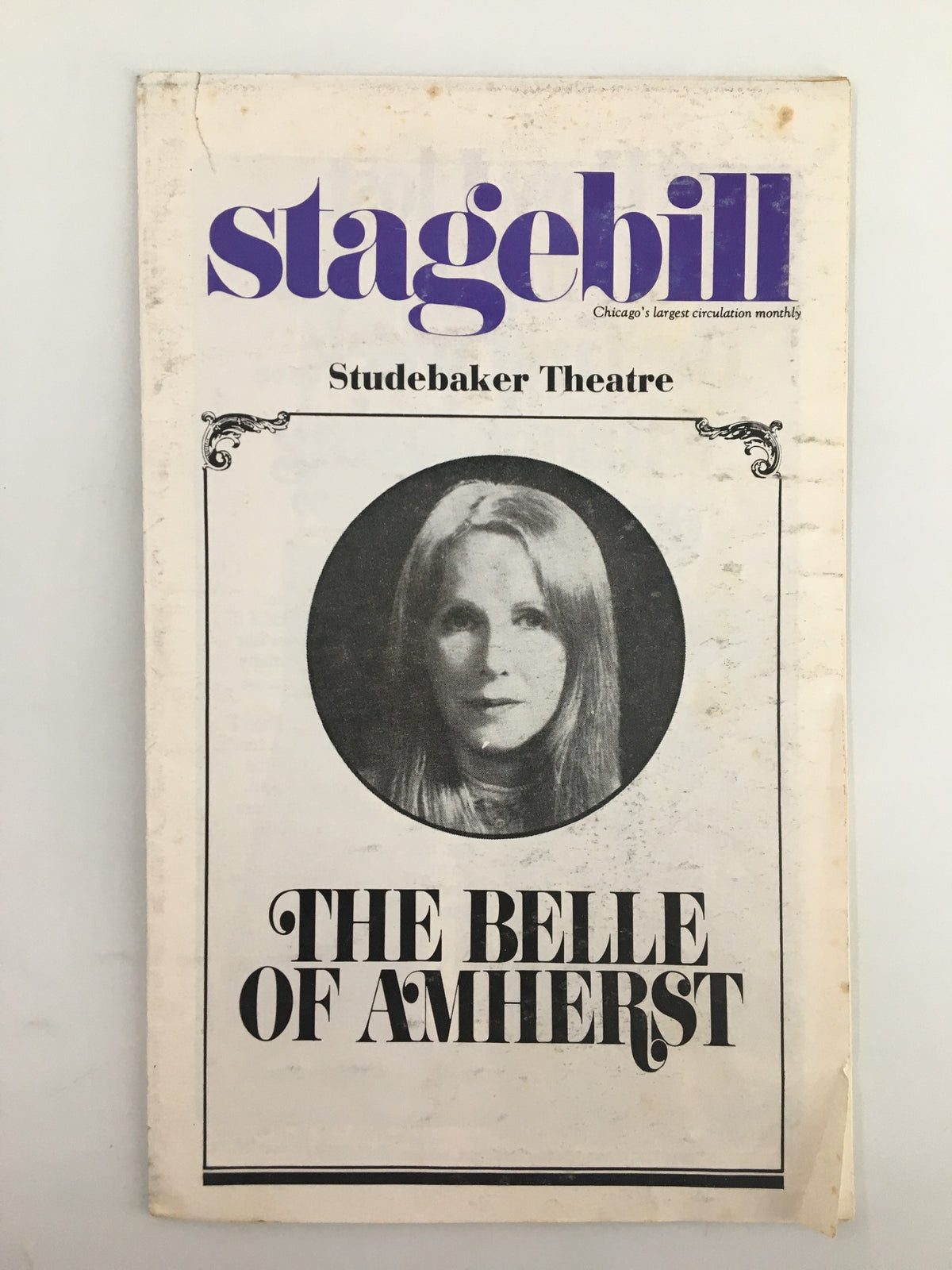 1976 Stagebill for The Belle of Amherst at Studebaker Theatre, featuring a black and white image of a young woman in a circular frame on the cover.