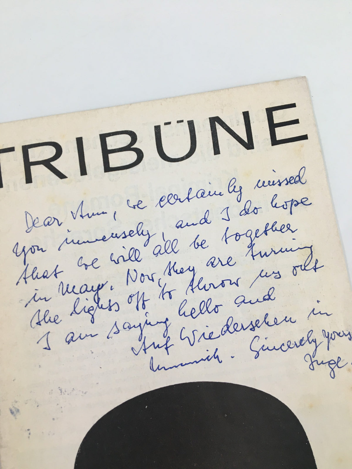 Close-up of the cover of the 1963 German Program Tribune for Das Komplott, displaying a handwritten message that adds personal charm.