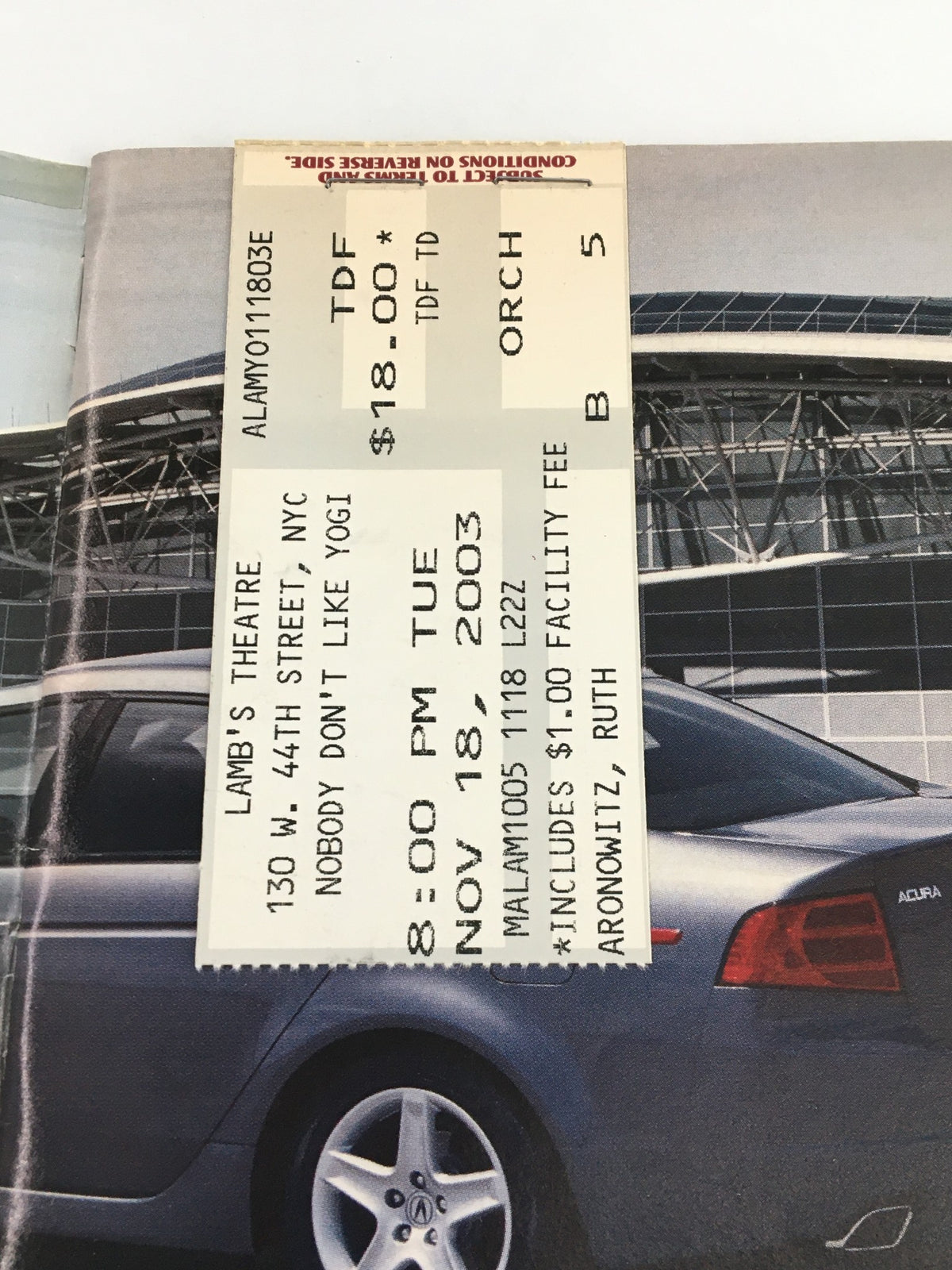 Ticket stub for Nobody Don't Like Yogi at Lamb's Theatre, dated November 18, 2003, showcasing the event details in a classic design.