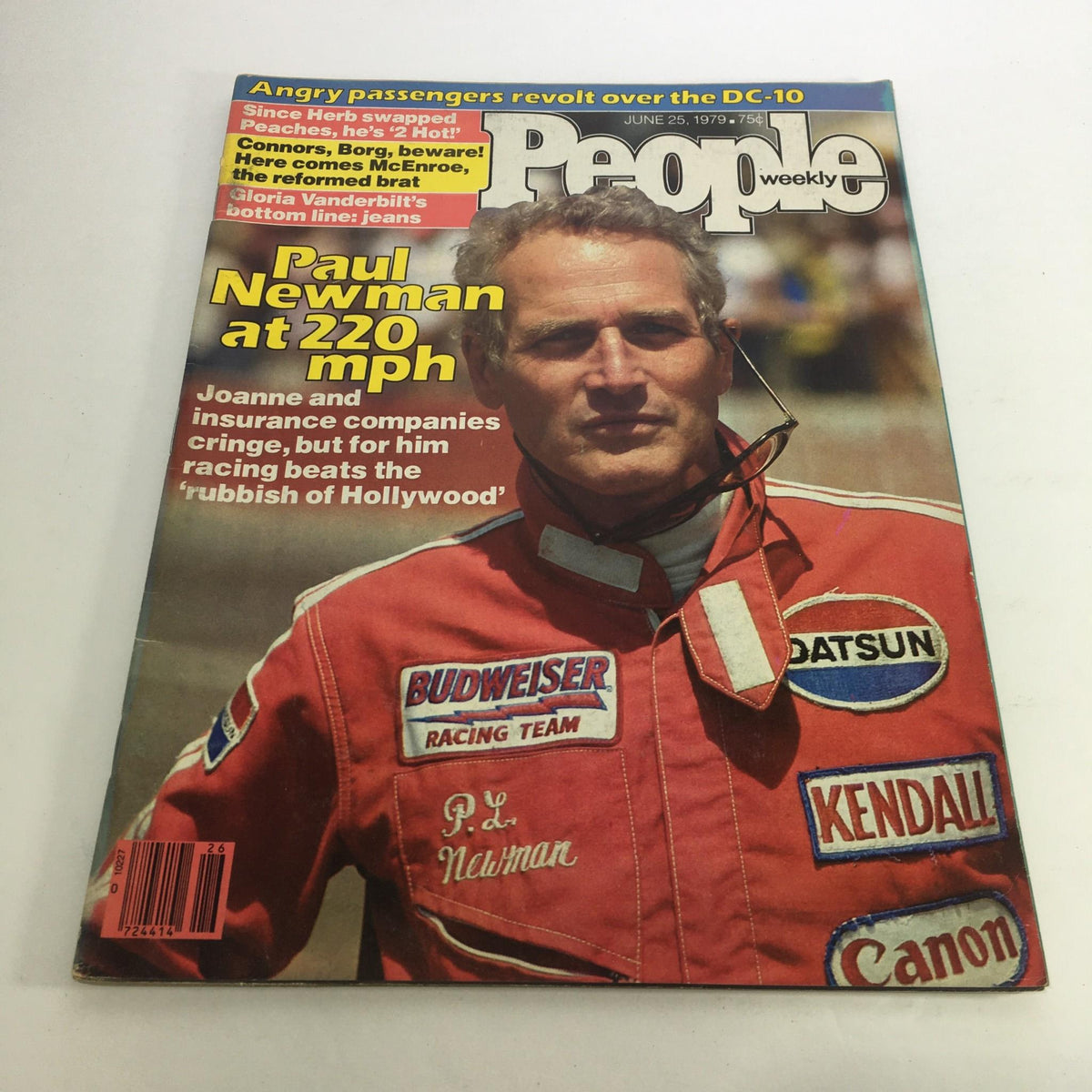 Cover of People Magazine dated June 25, 1979, featuring Paul Newman, with the headline 'Paul Newman at 220 mph Racing Beats Hollywood,' showcasing Newman in a racing suit, emphasizing his passion for racing alongside his Hollywood career.