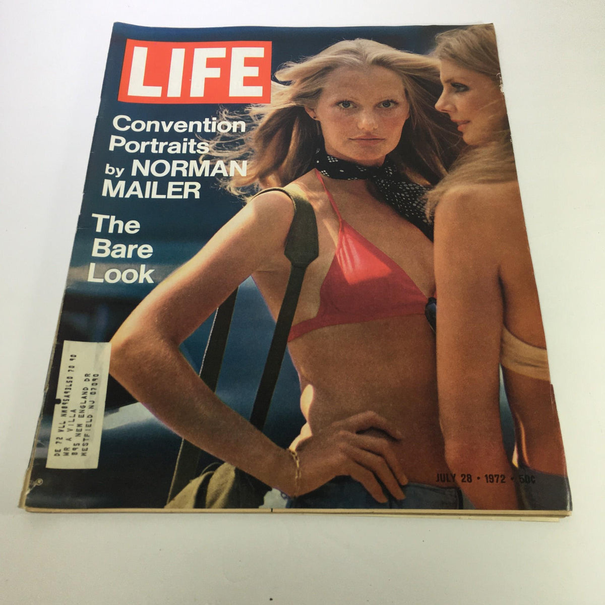 Cover of Life Magazine dated July 28, 1972, featuring Convention Portraits by Norman Mailer, showcasing two models in swimsuits. The cover highlights the theme 'The Bare Look' and includes promotional text about the photo essay by acclaimed photojournalist Norman Mailer.