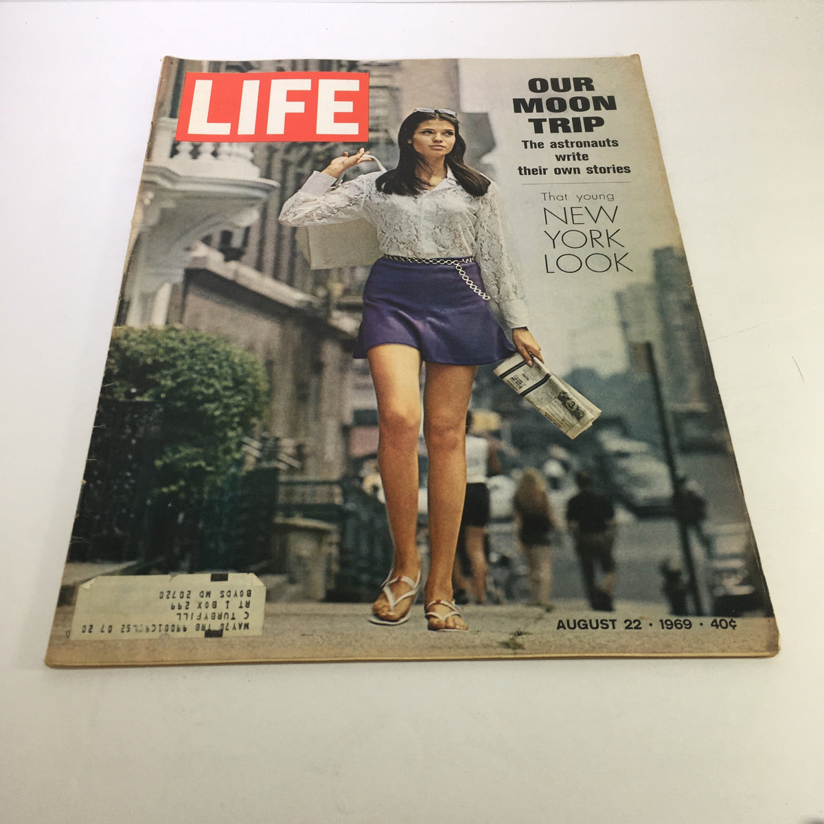 Cover of Life Magazine, dated August 22, 1969, featuring the title 'Our Moon Trip' with a young woman in a stylish outfit walking on a street in New York City, capturing the essence of 1960s youth culture.
