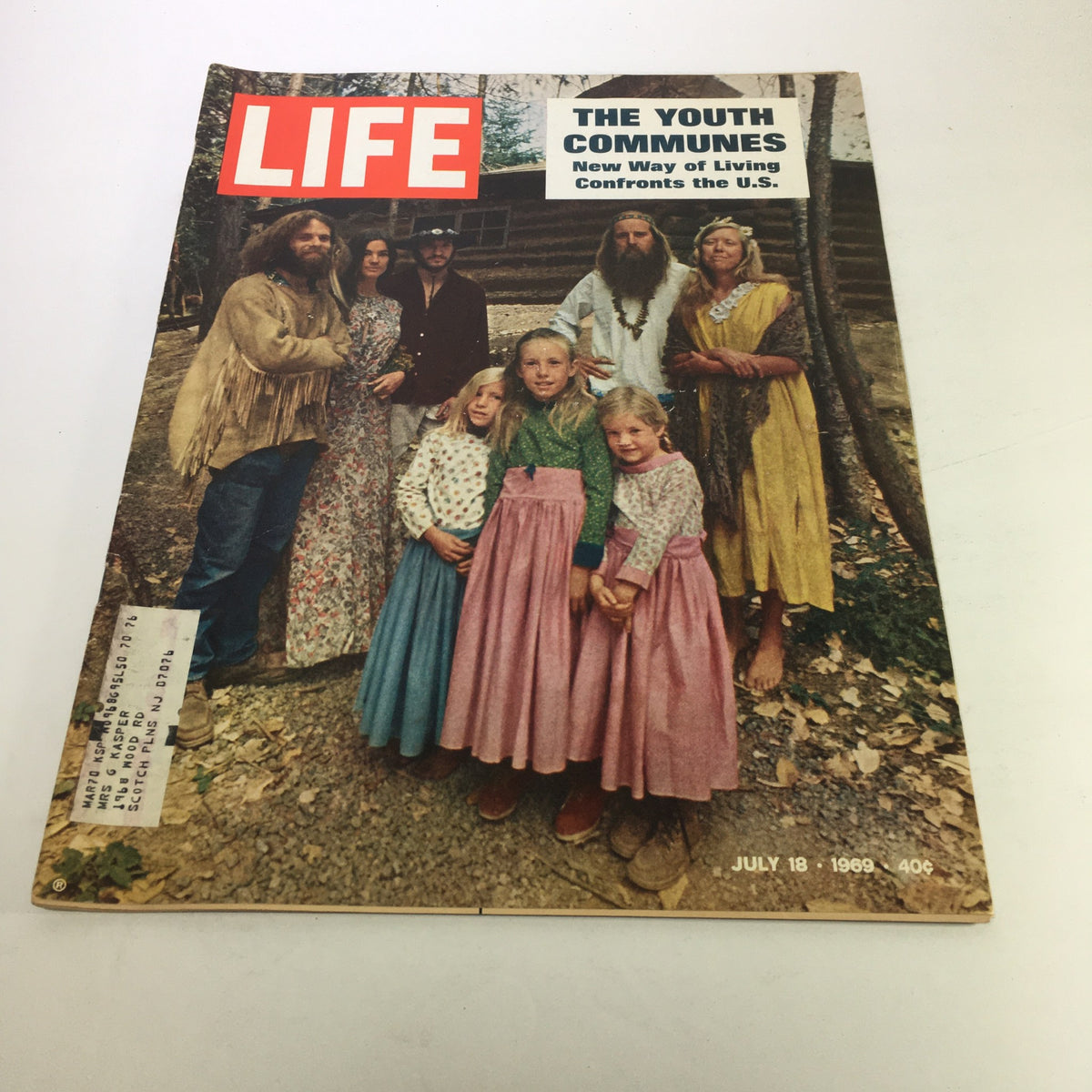 Cover of Life Magazine from July 18, 1969, featuring the title "The Youth Communes New Way of Living." The cover depicts a group of individuals showcasing the communal lifestyle of the 1960s, reflecting the cultural shifts and social changes of the era.