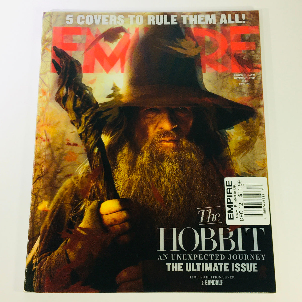 Empire Magazine December 2012 featuring Ian McKellen as Gandalf from The Hobbit. Limited edition cover showcasing the iconic character with fiery backdrop, perfect for collectors.