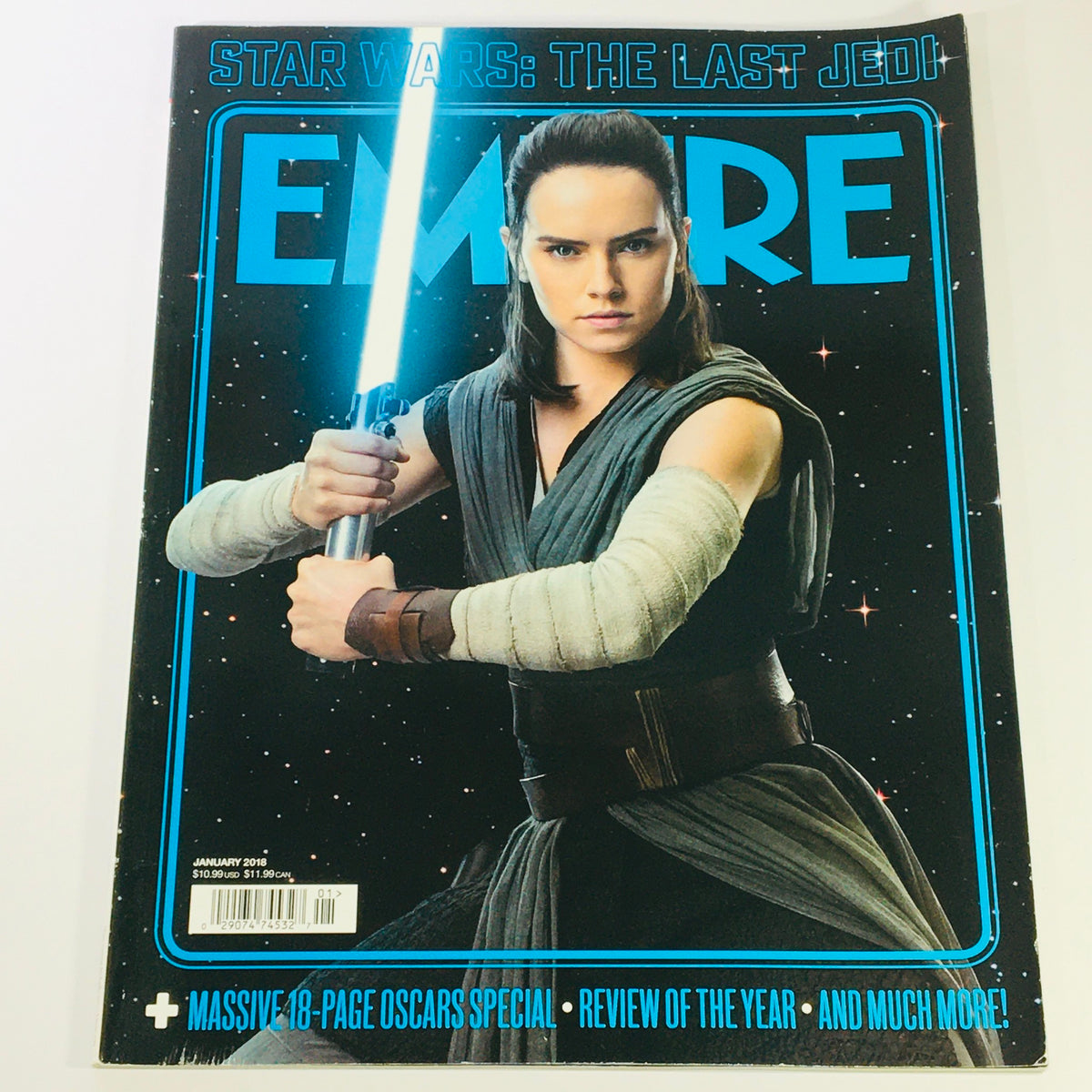 Empire Magazine January 2018 featuring Daisy Ridley on the cover, showcasing her as Rey from Star Wars: The Last Jedi, with a lightsaber against a starry background.