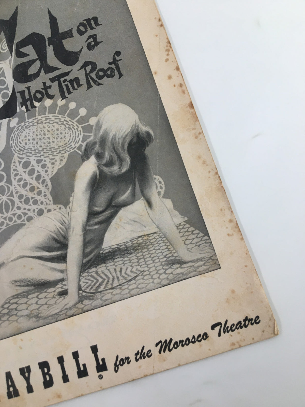 Close-up of the 1955 Playbill for Morosto Theatre of 'Cat On A Hot Tin Roof', highlighting the artistic design and vintage details of the theatre publication.