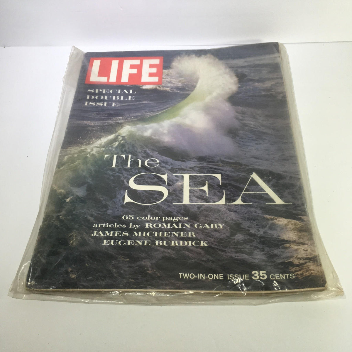Vintage Life Magazine cover from December 12, 1962 featuring 'The Sea' in a special double issue, showcasing powerful ocean waves and iconic articles by Romain Gary, James Michener, and Eugene Burdick.