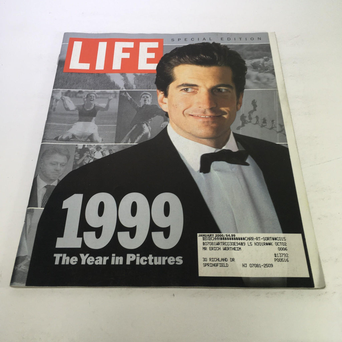 Cover of Life Magazine Special Edition: January 2000 - The Year in Pictures of 1999 featuring an iconic photo of a man in a tuxedo, set against a collage of significant moments from 1999, highlighting cultural events and notable figures.