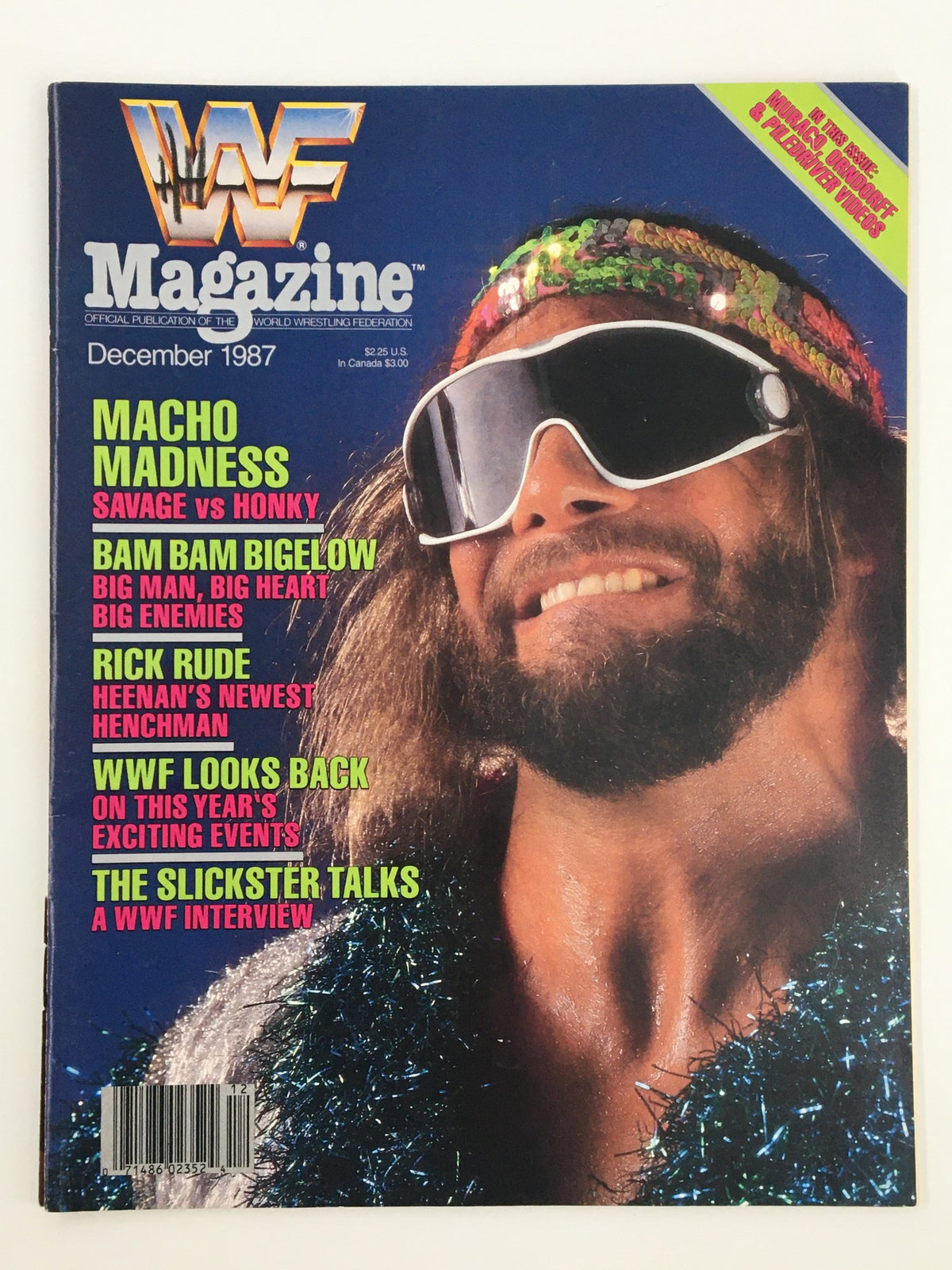 Cover of VTG WWF Magazine December 1987 featuring Randy Savage with sunglasses and a colorful headband, highlighting the match between Randy Savage and Honky Tonk Man.
