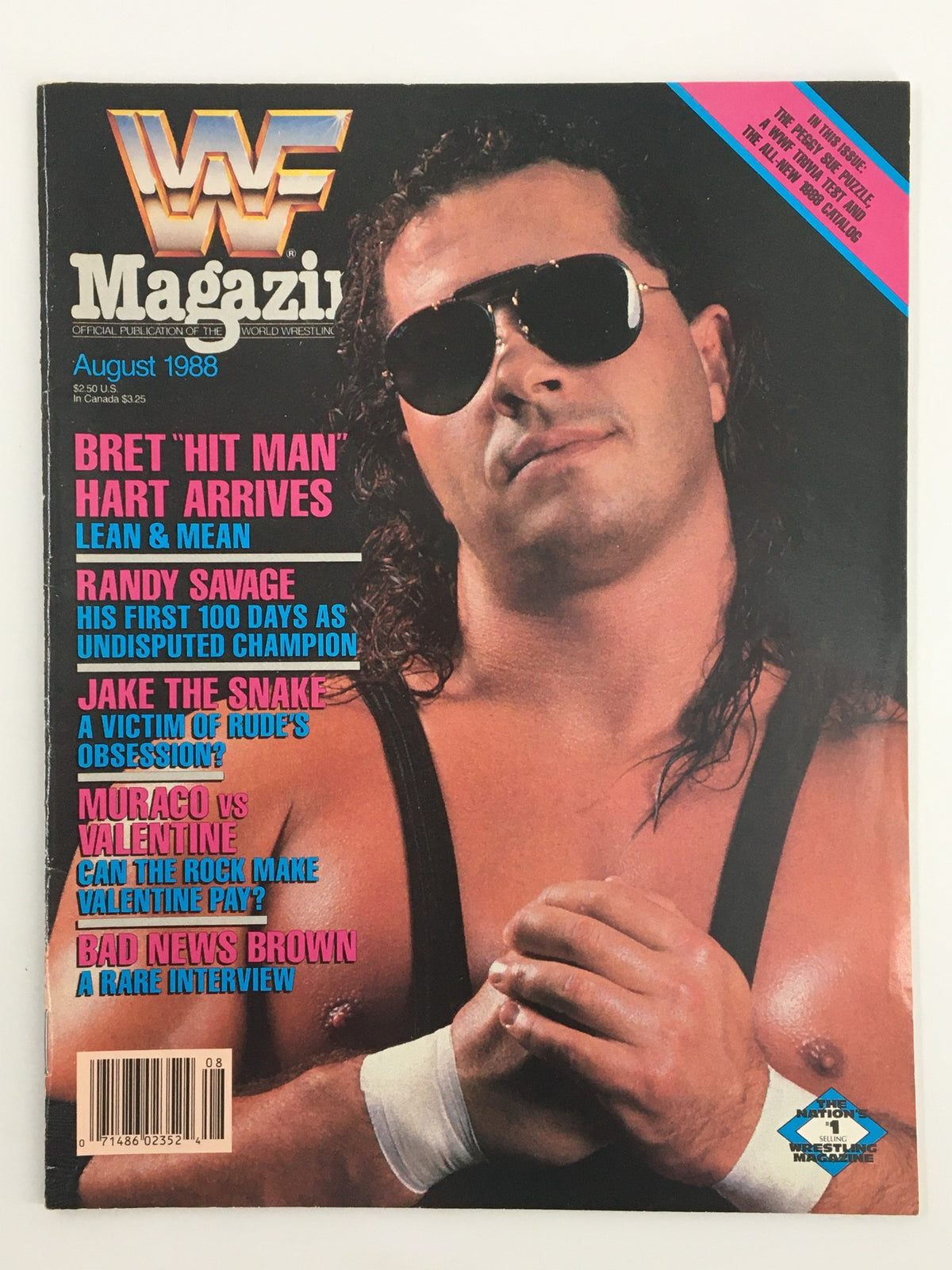 Cover of VTG WWF Magazine August 1988 featuring Bret Hart, Randy Savage, and Jake The Snake, highlighting wrestling icons with features like 'Bret Hit Man Hart Arrives' and 'Randy Savage His First 100 Days'.