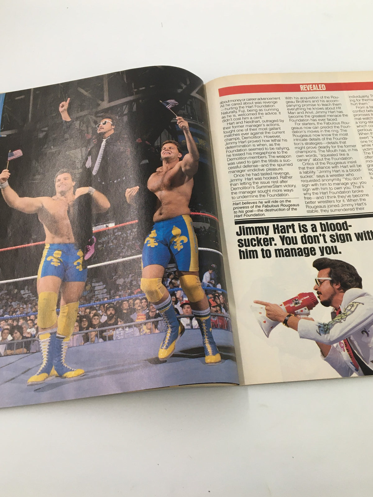 Inside page of the December 1988 WWF Magazine displaying Jimmy Hart managing The Fabulous Rougeaus in the wrestling ring.