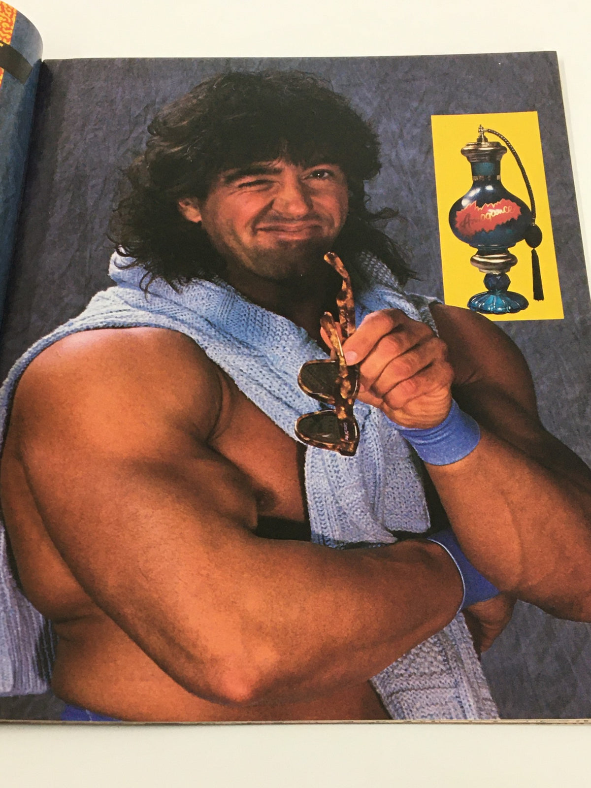A promotional image of a wrestler from the September 1990 issue of WWF Magazine, posing with sunglasses and a towel.