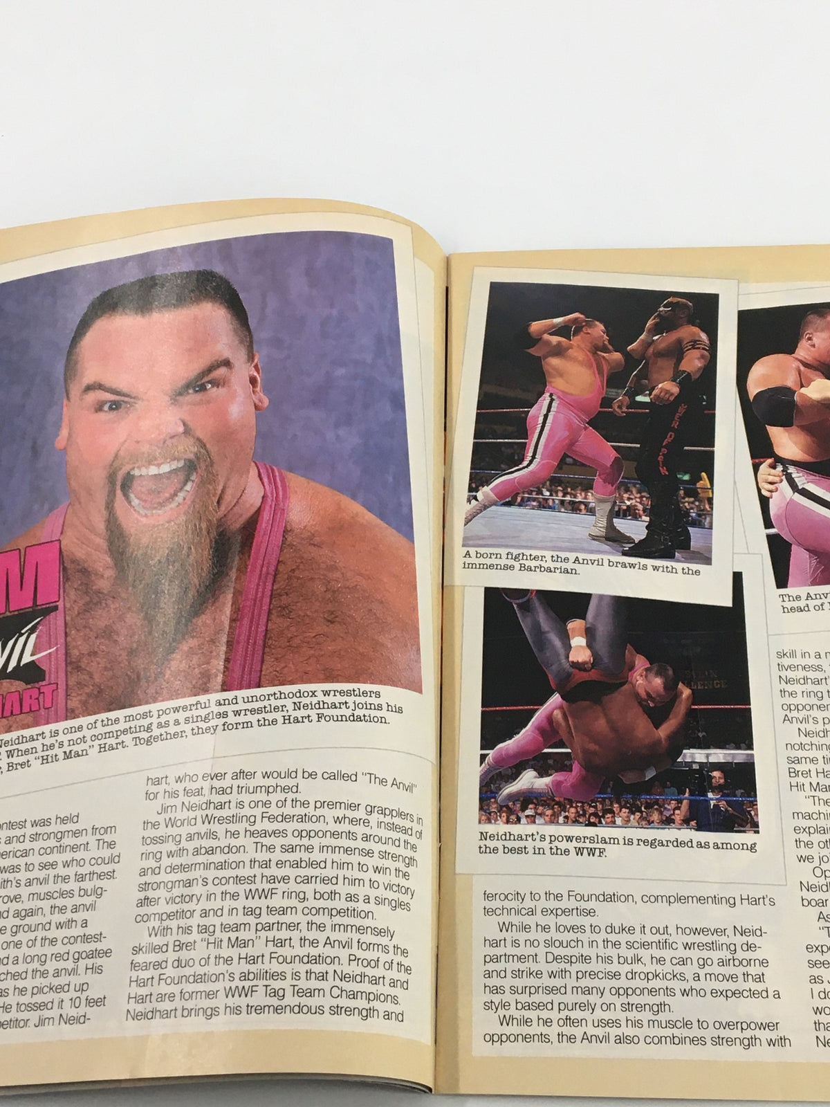 Inside page of the April 1990 WWF Magazine showcasing a profile of Jim Neidhart, with dynamic action shots from wrestling matches.