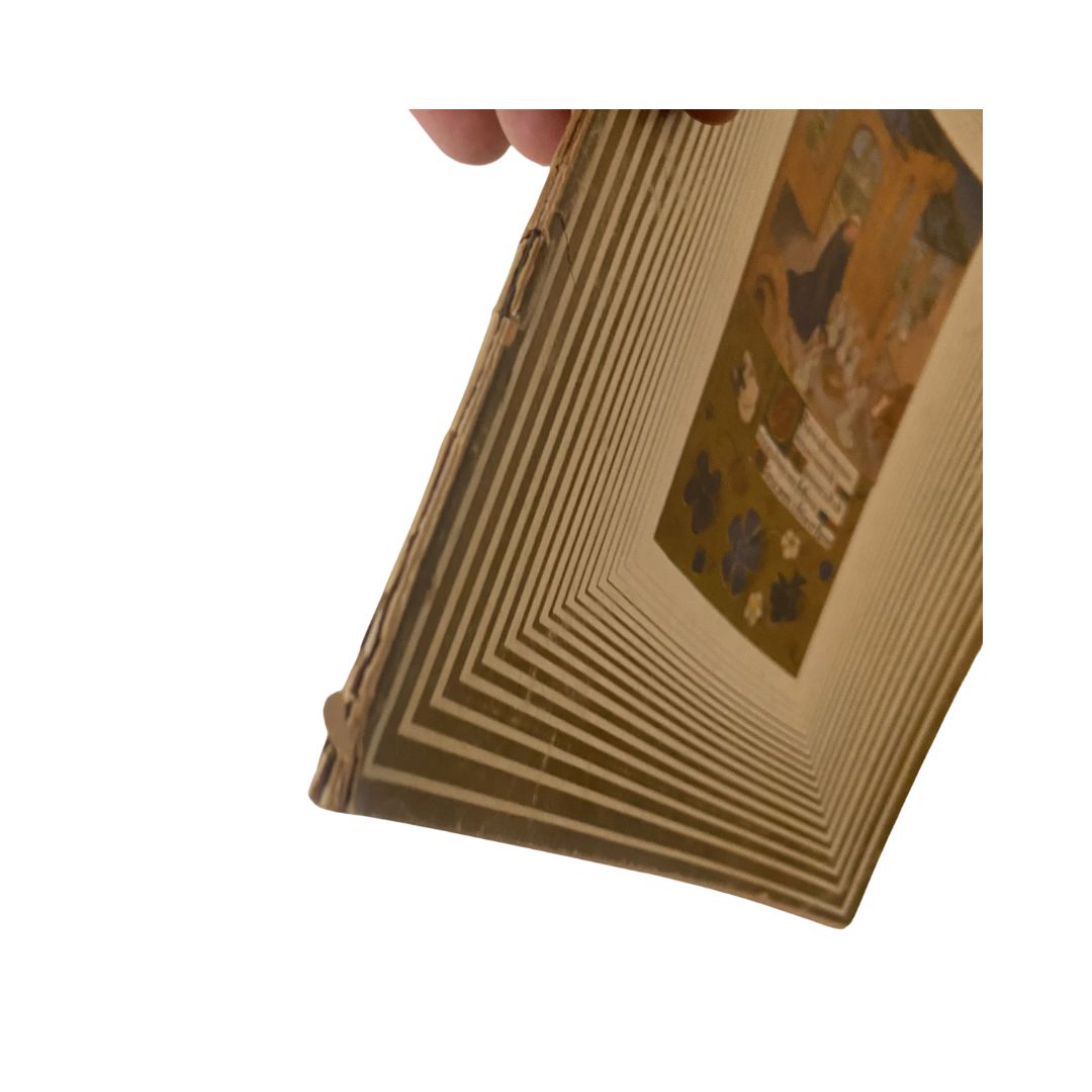 Side view of the Vintage Art News Magazine highlighting the unique spiral design and spine, showcasing the title 'VTG Art News Magazine December 1-14, 1942 Adoration of the Child'.