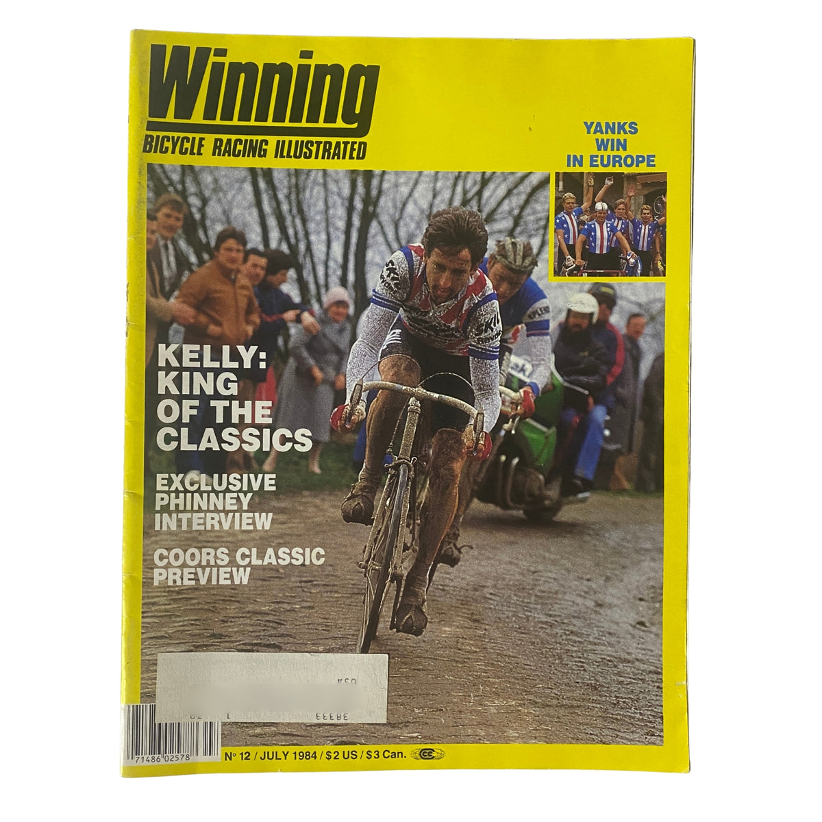 Cover of Winning Bicycle Racing Illustrated, July 1984, No. 12 featuring Sean Kelly, showcasing his victory at Paris-Roubaix, with a vibrant yellow background and cycling imagery.