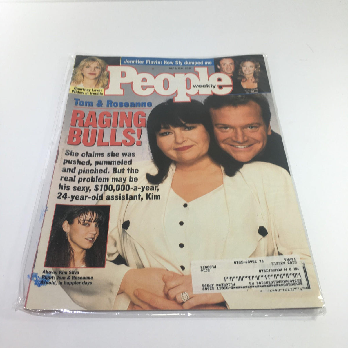 Cover of People Magazine dated May 2, 1994, featuring Tom and Roseanne Arnold in happier days with the headline 'Raging Bulls!'. The cover highlights a story about celebrity relationships from the early '90s, showcasing the charm of that era.