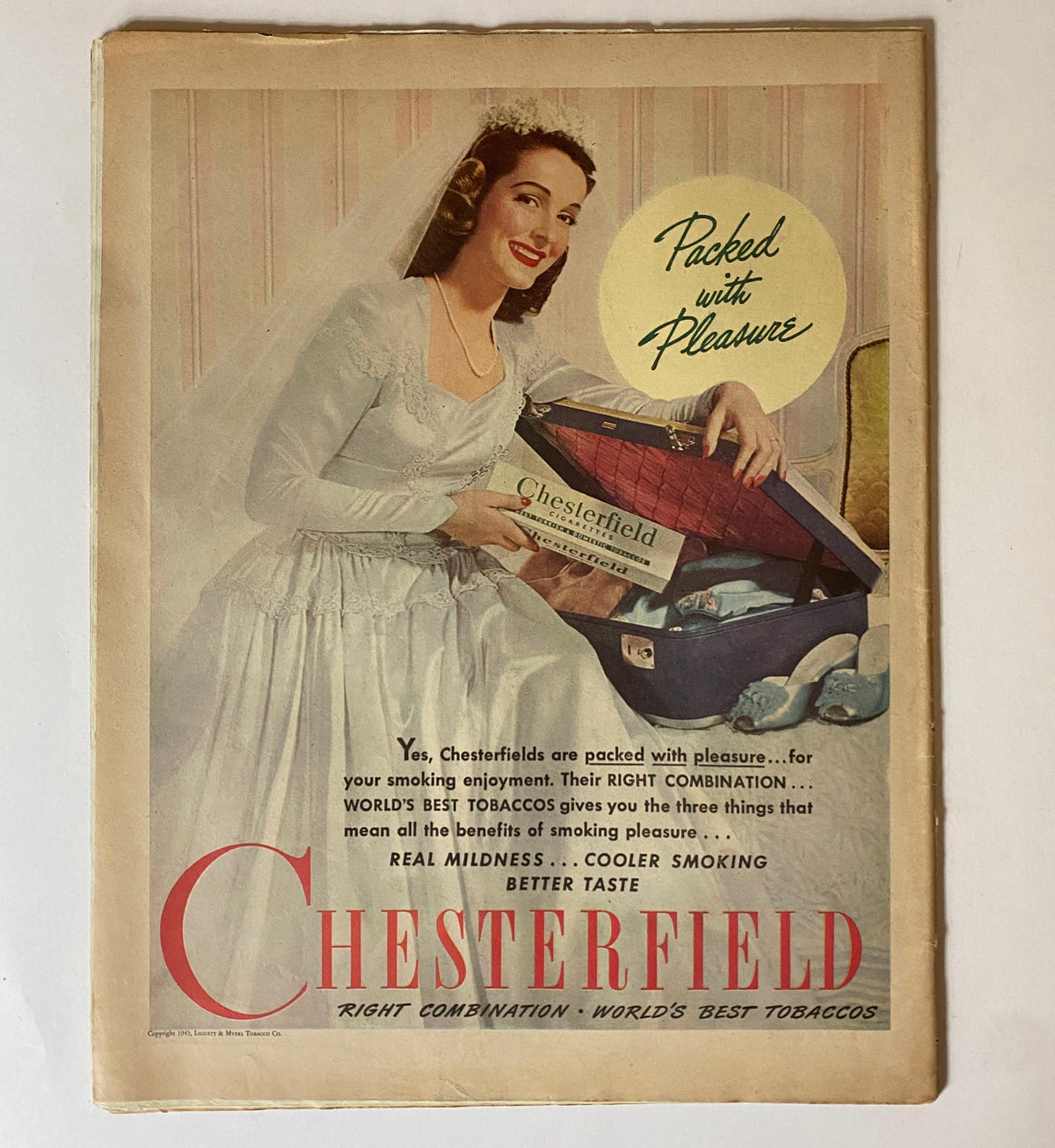 Vintage advertisement for Chesterfield cigarettes in the VTG Collier's Magazine June 16, 1945, showcasing a smiling woman in a wedding dress promoting the brand.