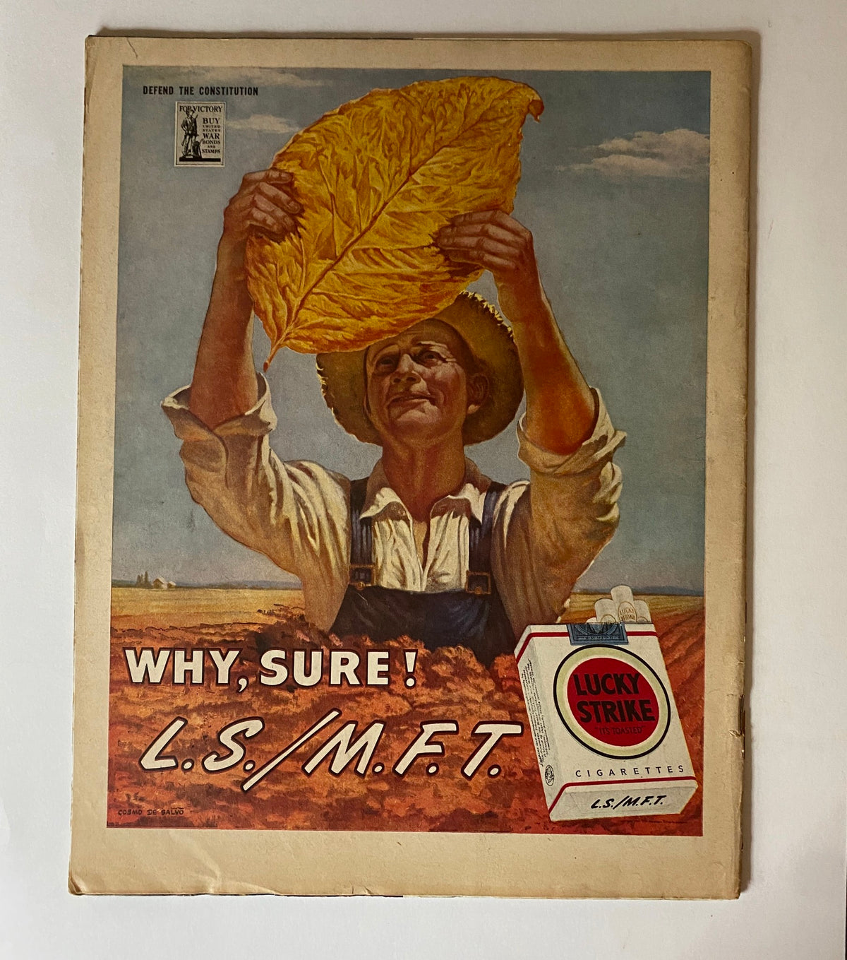Advertisement page from VTG Collier's Magazine January 20, 1945 showcasing a man holding a large tobacco leaf with a Lucky Strike cigarette advertisement.