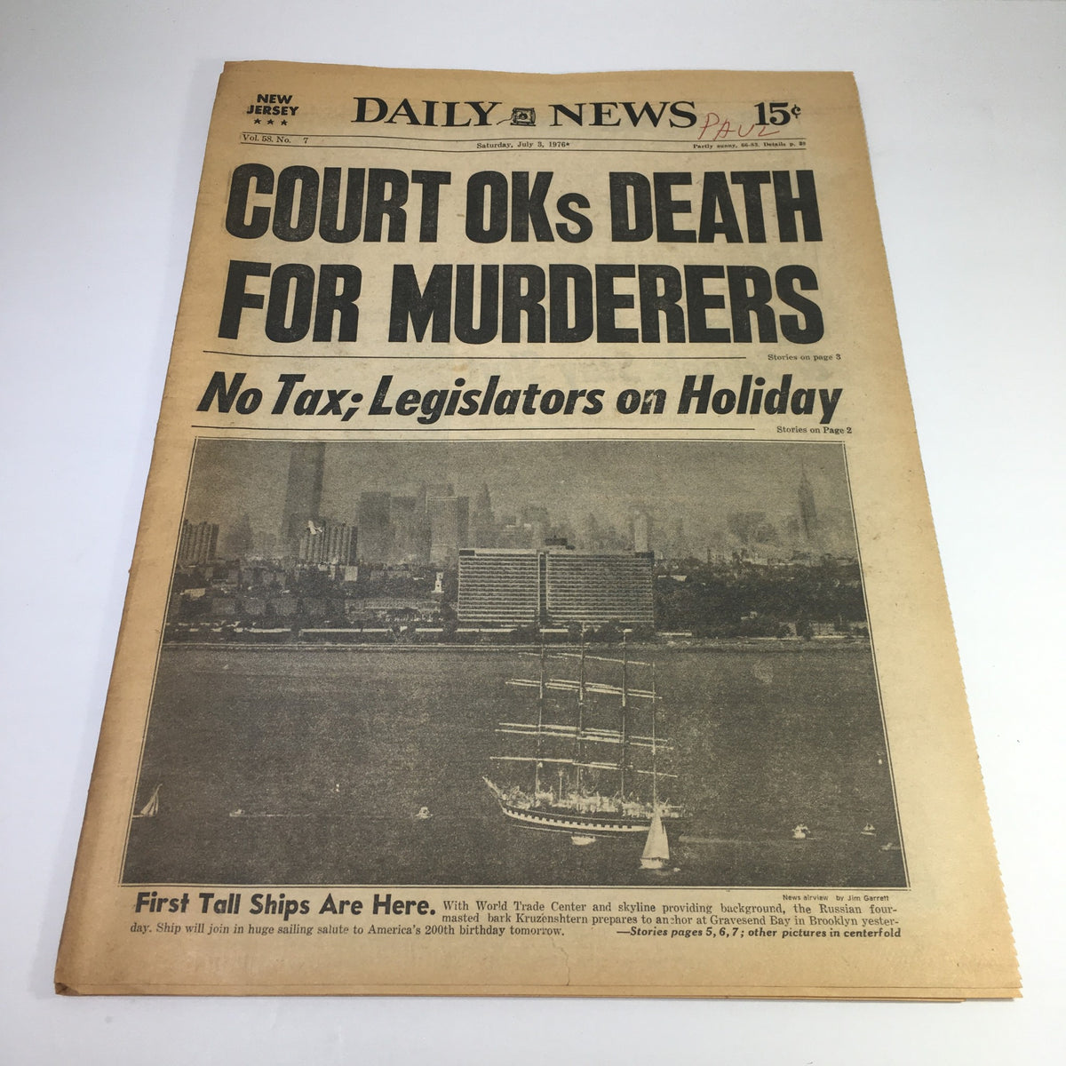 NY Daily News headline from July 3, 1976, reading 'Court OKs Death For Murderers - No Tax; Legislators on Holiday', showcasing a significant moment in legal history against a backdrop of historical ships in New York.