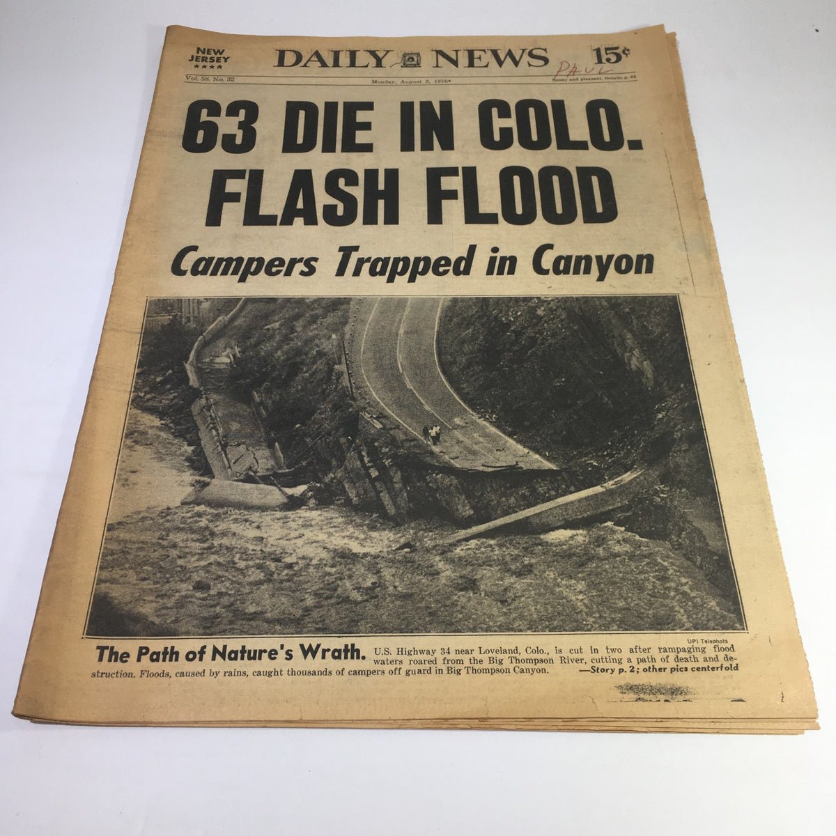 NY Daily News from August 2, 1976, featuring the headline '63 Die in Colo. Flash Flood: Campers Trapped in Canyon', showcasing a vintage design that captures a significant historical event.