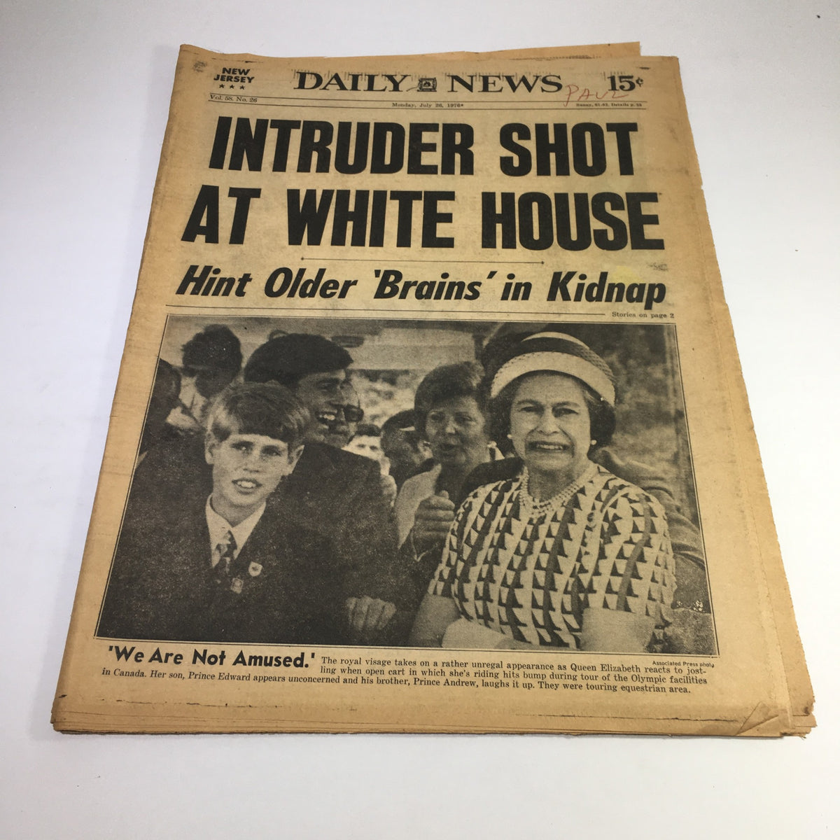 NY Daily News headline from 7/26/76 reporting on an intruder shot at the White House, featuring Queen Elizabeth and Prince Edward. Image captures the historical significance of the event.