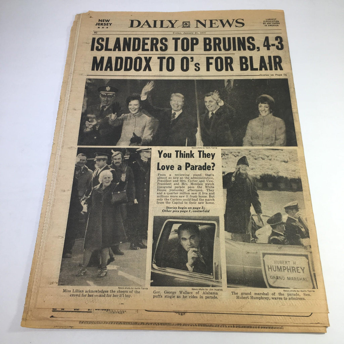 NY Daily News sports headline showcasing the Islanders defeating the Bruins 4-3, featuring images of parade celebrations and political figures, underscoring the excitement of the event.